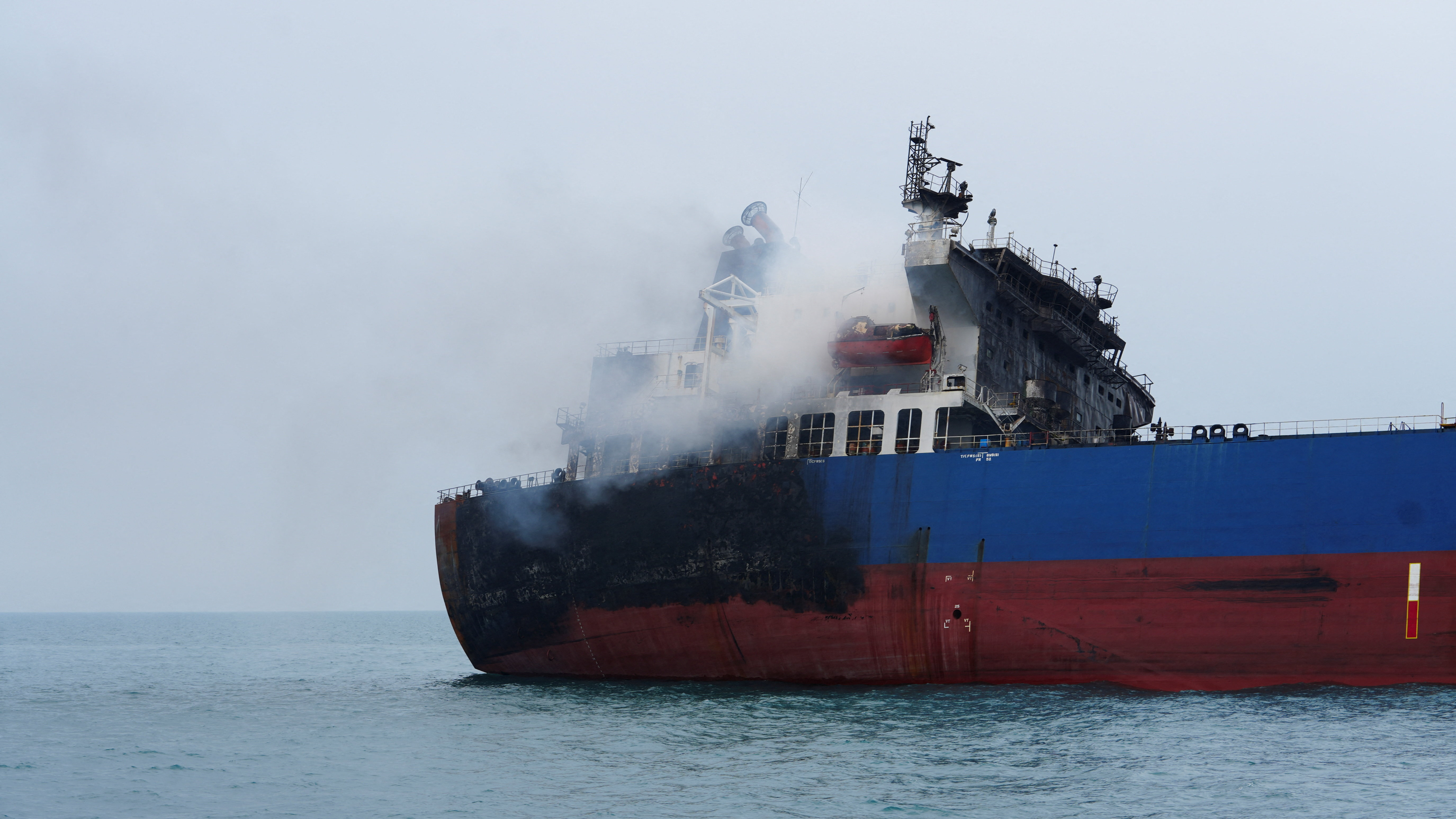 A foreign tanker carrying Iraqi fuel oil damaged after catching fire in Iraq's territorial waters, following unidentified attacks that targeted two foreign tankers, according to Iraqi port officials