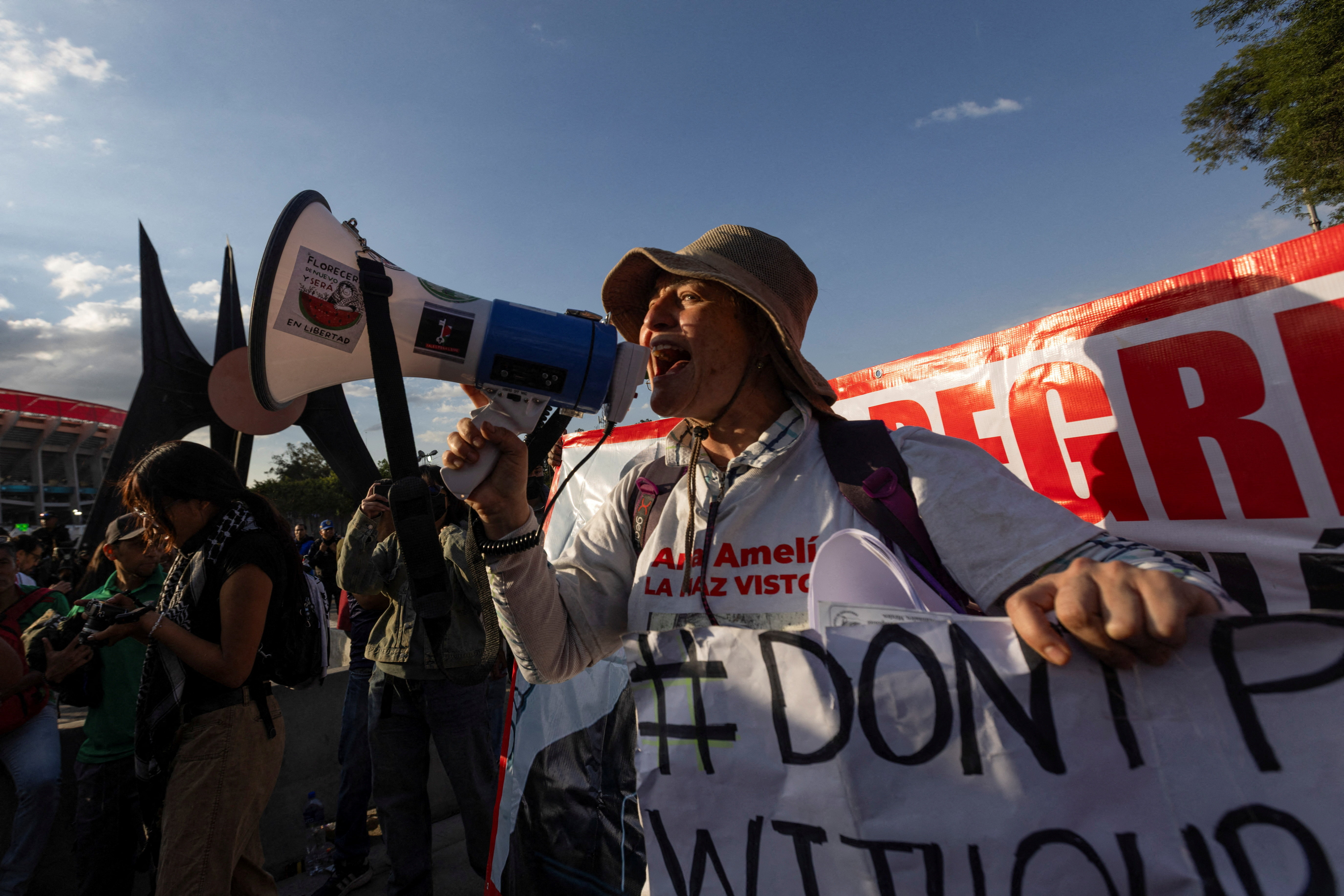 Relatives of victims of forced disappearance protest outside Azteca Stadium, officially renamed Estadio Banorte, on the day of a friendly match between the national teams of Mexico and Portugal held to mark the stadium’s inauguration, as Mexico prepares for the 2026 FIFA World Cup co-hosted by the United States, Canada and Mexico, in Mexico City, Mexico, March 28, 2026. REUTERS/Quetzalli Nicte-Ha