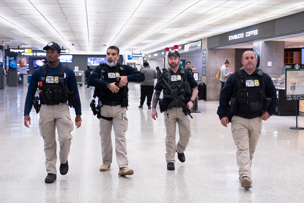 Armed federal agents at an airport