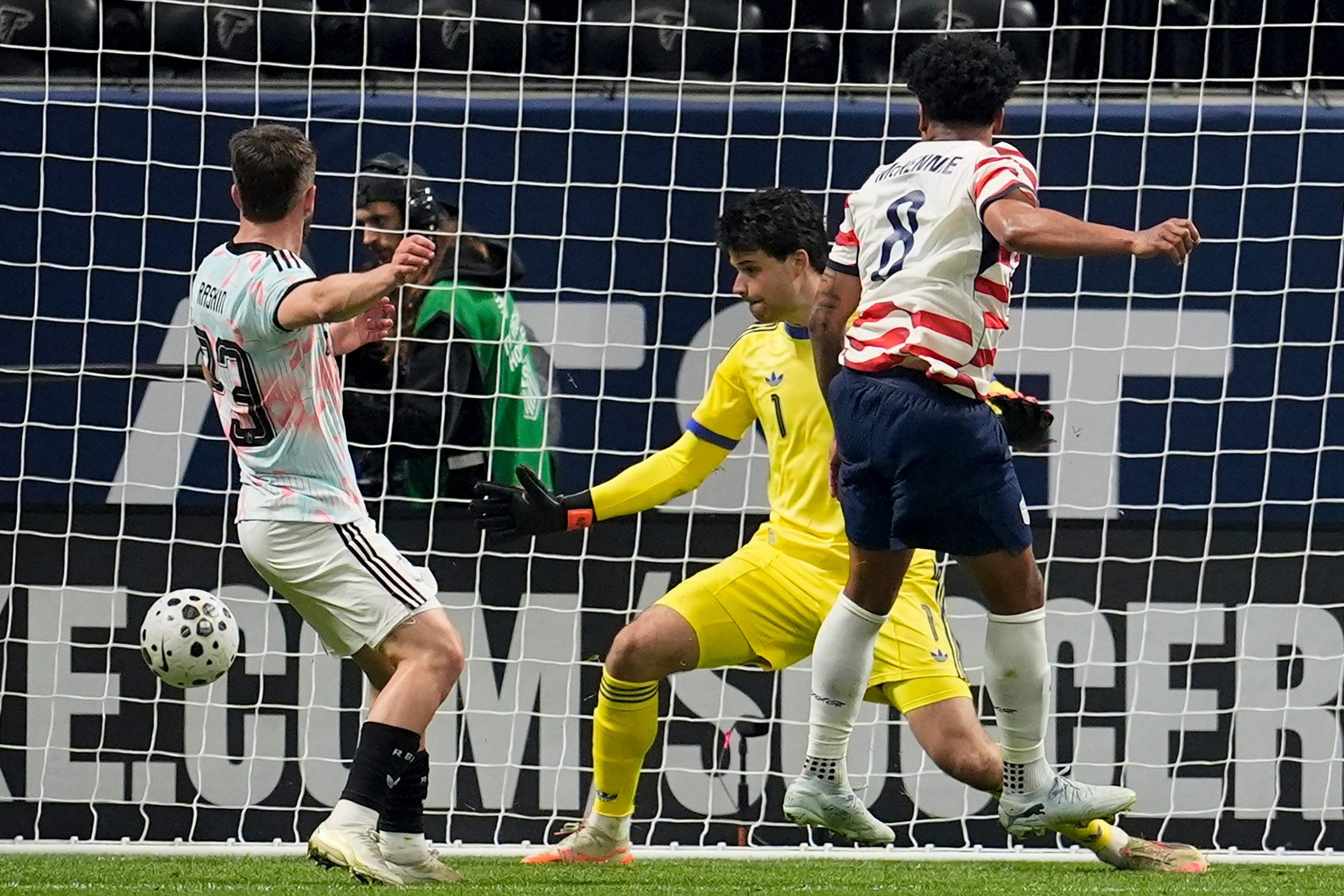 United States' Weston McKennie (8) scores past Belgium' goalkeeper Senne Lammens during the first half of an international friendly soccer match, Saturday, March 28, 2026, in Atlanta. (AP Photo/Mike Stewart)
