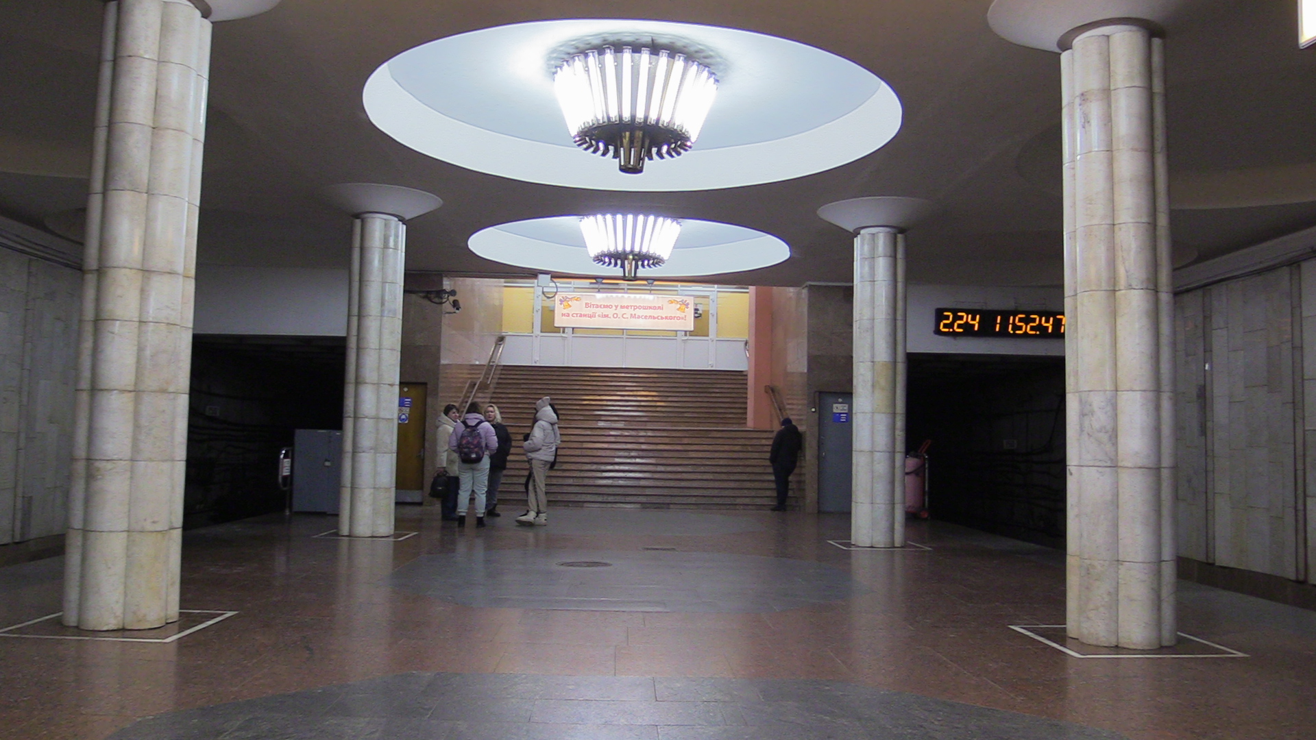 Parents waiting for children near the entrance to a subway school in Kharkiv, Ukraine-1773655980
