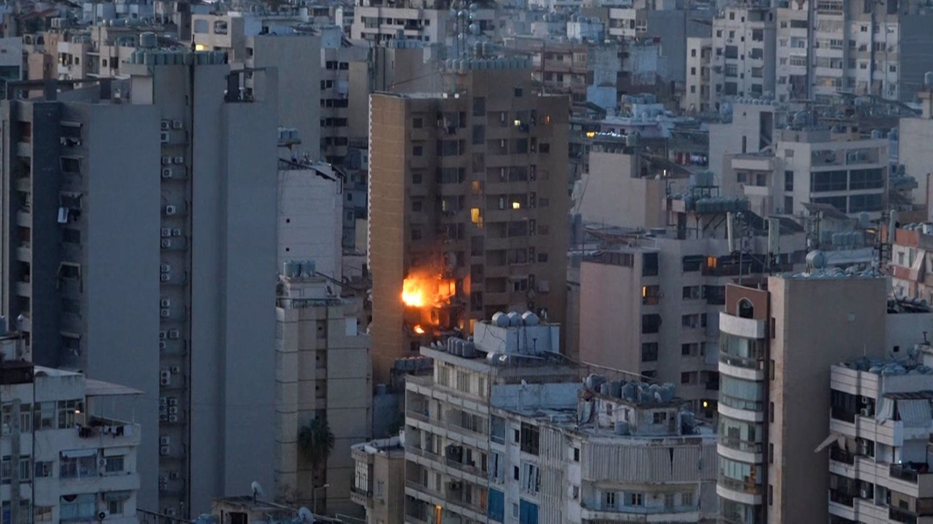 Flames erupt from the side of a building in central Beirut after an apparent Israeli strike on March 11, 2026. [Al Jazeera]