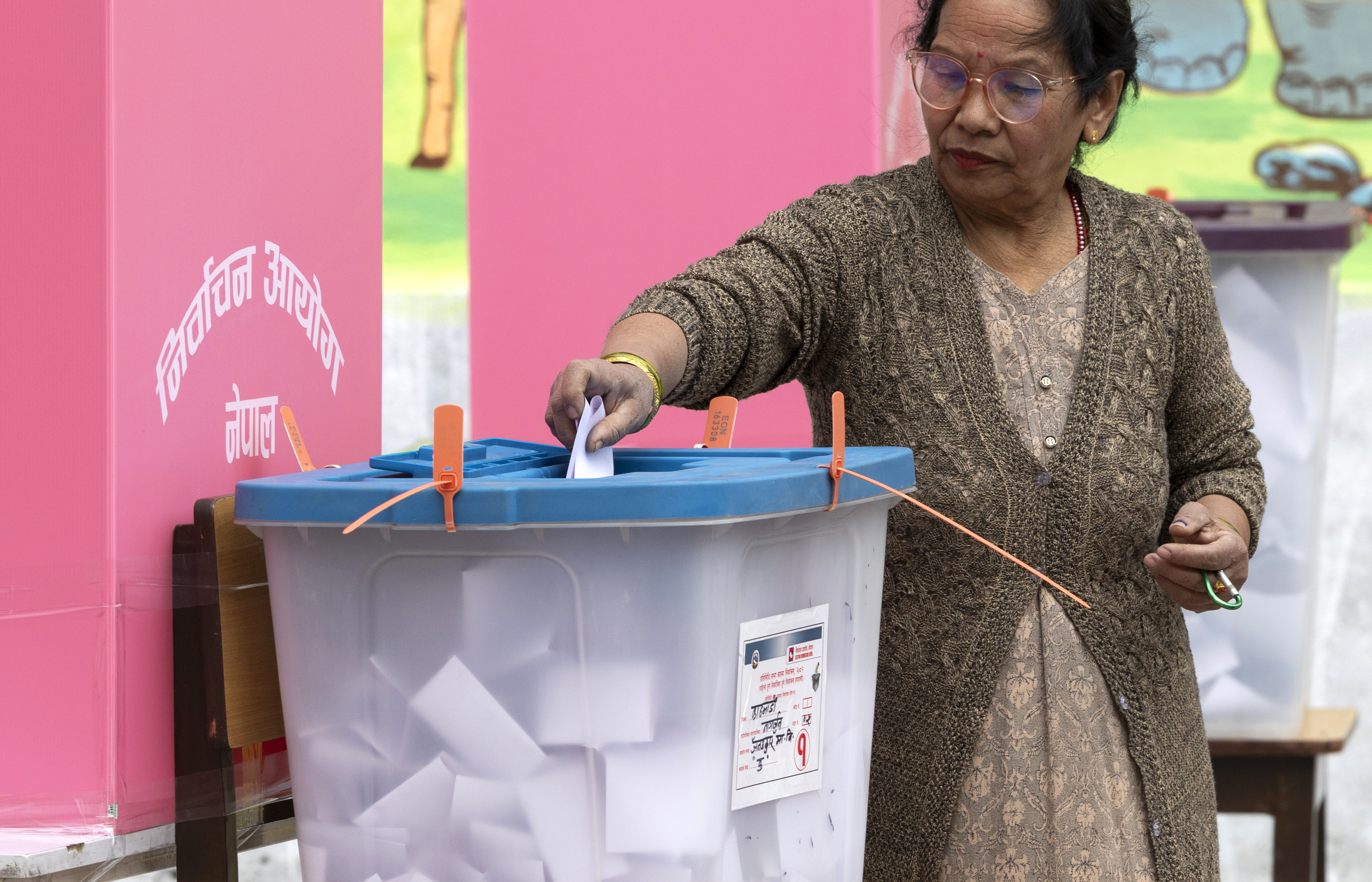 epa12796592 A woman casts her vote during the parliamentary elections in Kathmandu, Nepal, 05 March 2026. Nepal is holding its first elections since anti-government protests led to the collapse of the previous government in September 2025. EPA/NARENDRA SHRESTHA