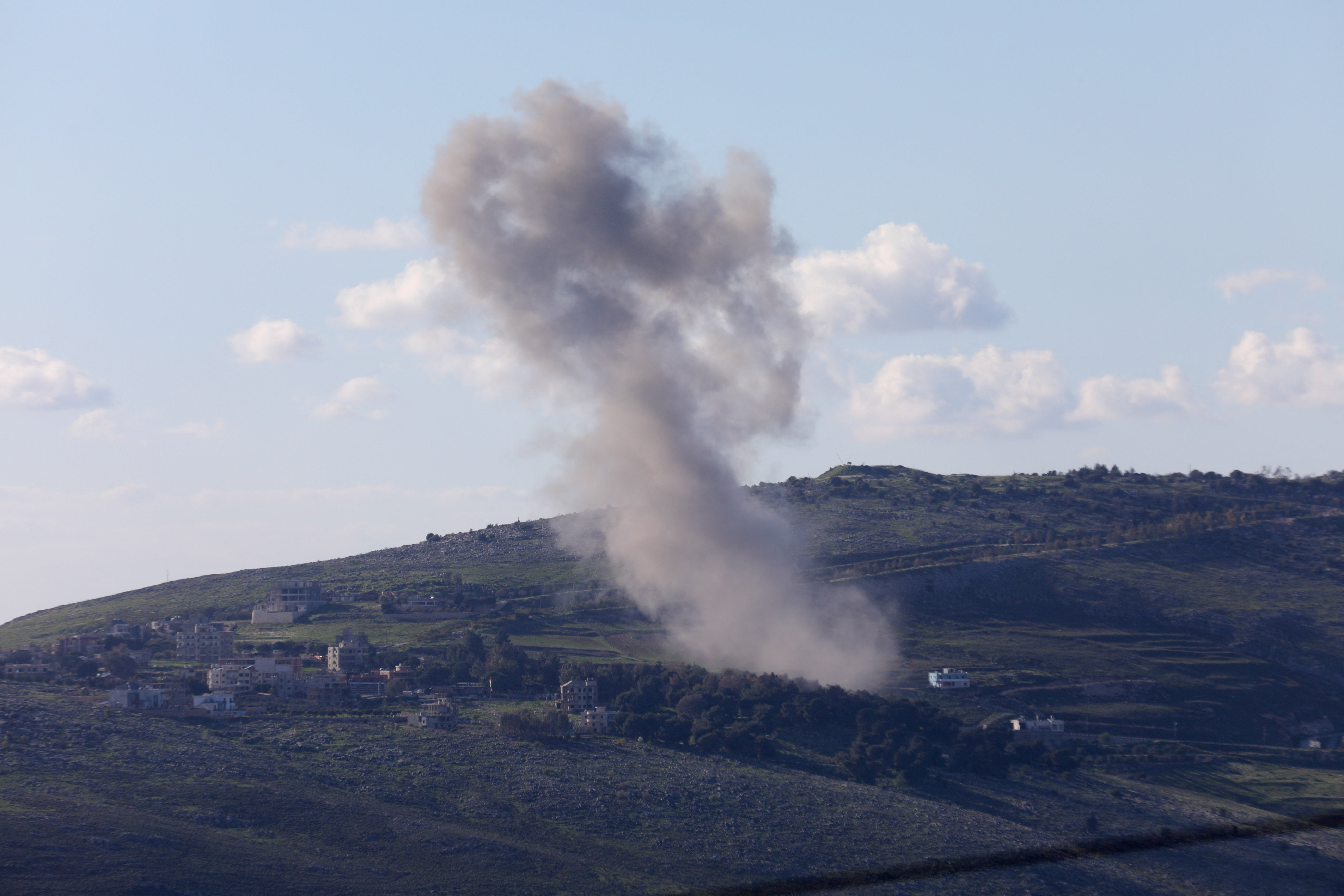 Smoke rises after Israeli strikes in Lebanon, following an escalation between Hezbollah and Israel amid the U.S.-Israeli conflict with Iran, as seen from Marjayoun, Lebanon, March 8, 2026. REUTERS/Karamallah Daher