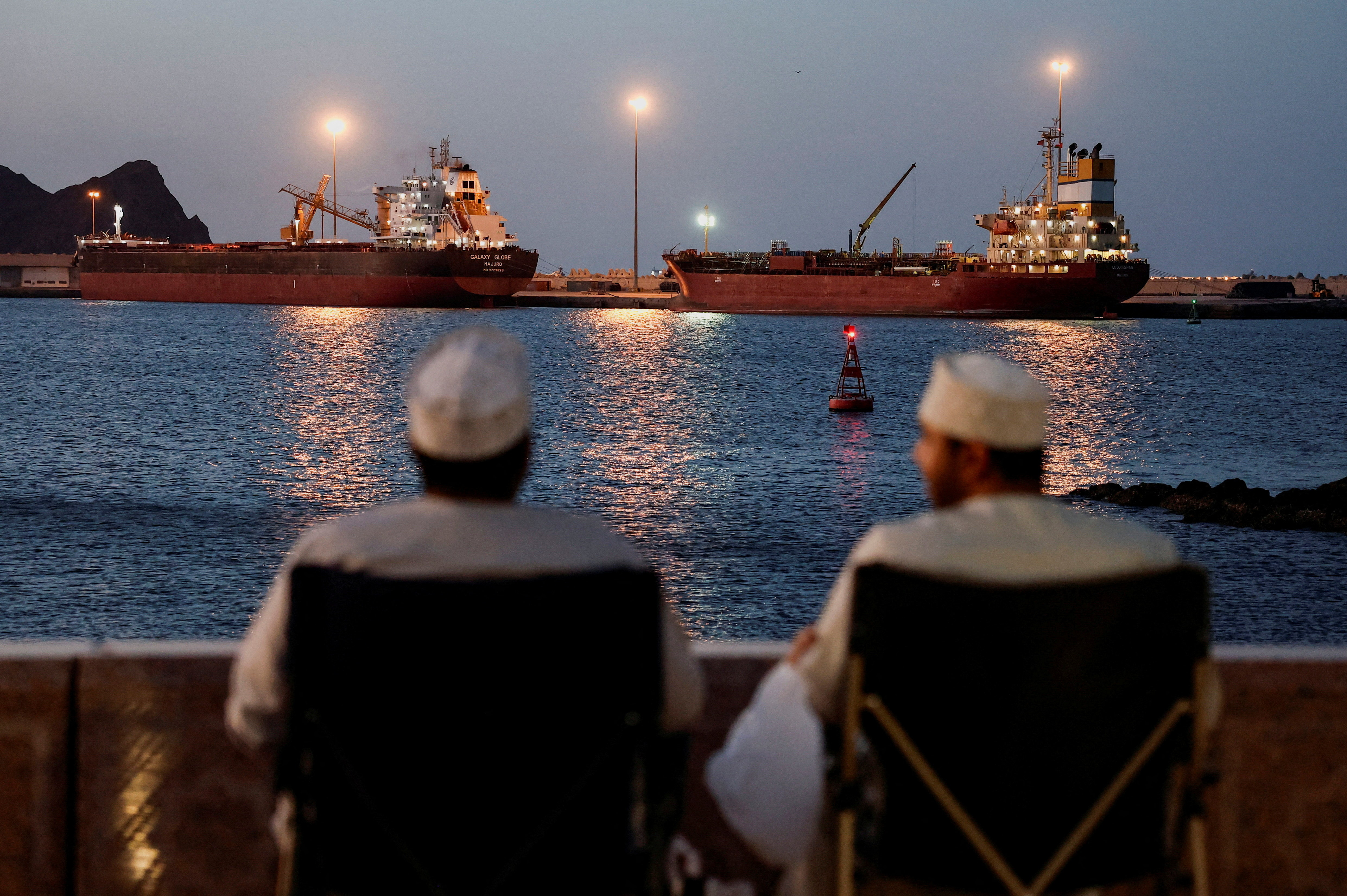 The Galaxy Globe bulk carrier and the Luojiashan tanker sit anchored as Iran vows to close the Strait of Hormuz, amid the U.S.-Israeli conflict with Iran, in Muscat, Oman, March 9, 2026. REUTERS/Benoit Tessier TPX IMAGES OF THE DAY