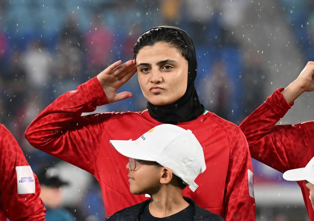 Iran player Fatemeh Pasandideh salutes during the national anthem of Iran prior to the AFC Women’s Asian Cup
