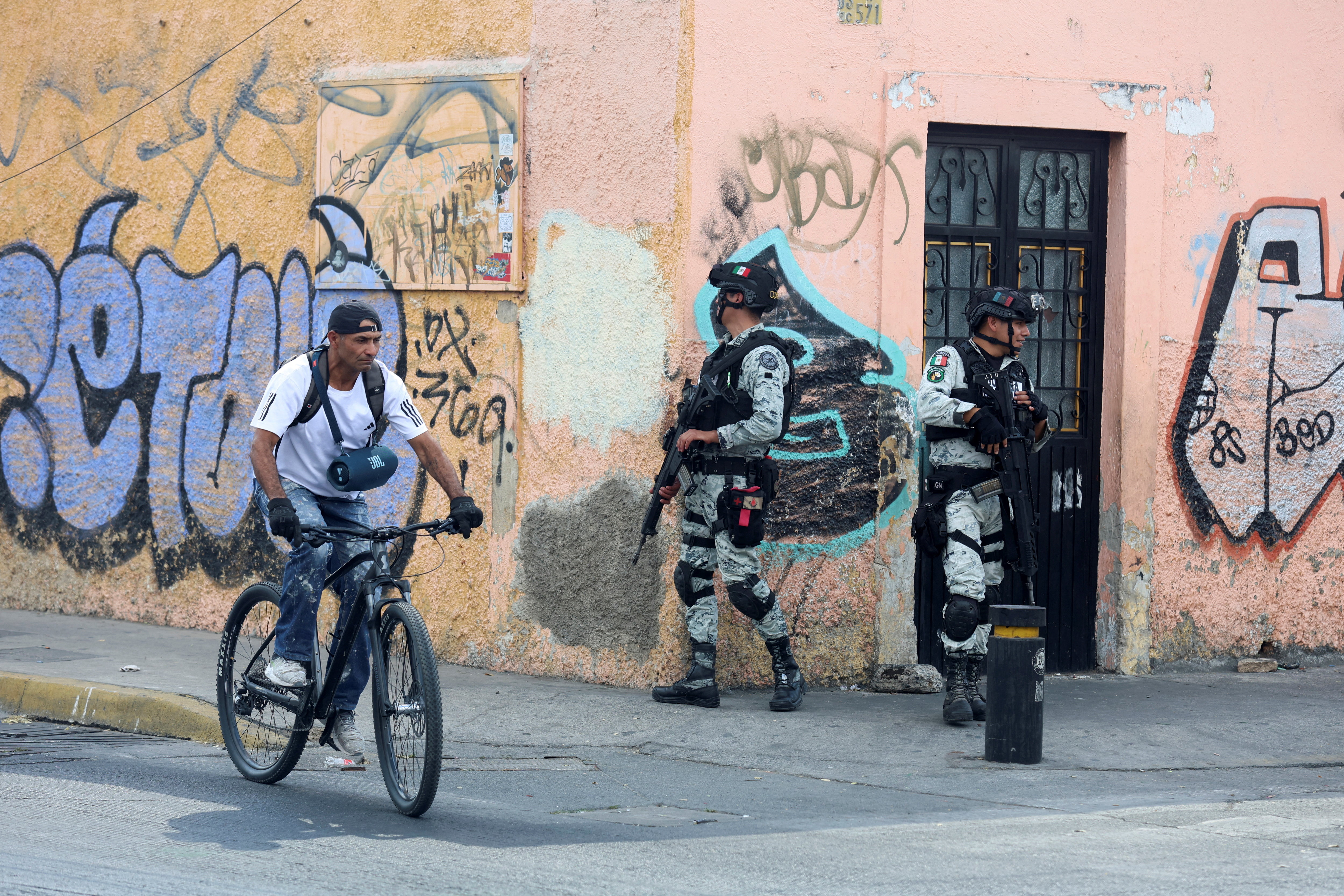 Members of the Mexican National Guard stand guard near the La Paz funeral home where, according to local media, the body of cartel leader Nemesio Oseguera Cervantes, known as "El Mencho," is being held after he was killed on February 22 during a military operation in the state of Jalisco, in Guadalajara, Mexico