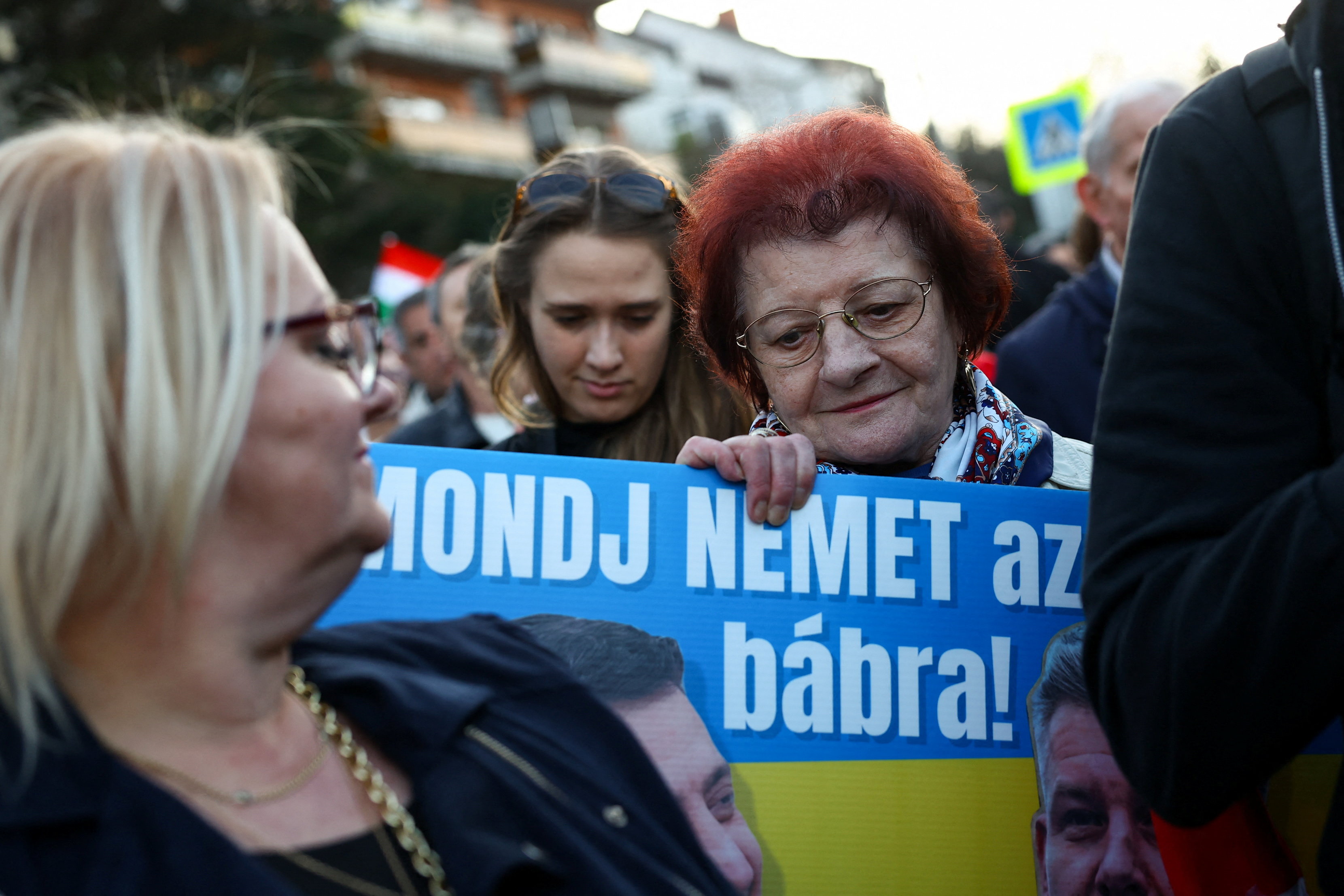 A woman holds a placard as people take part in a protest against what organisers call "Ukrainian blackmail" in Budapest, Hungary, March 6, 2026, as Kyiv and Budapest are locked in a dispute over an outage of the Druzhba pipeline, which supplies oil to Hungary and Slovakia. REUTERS/Bernadett Szabo