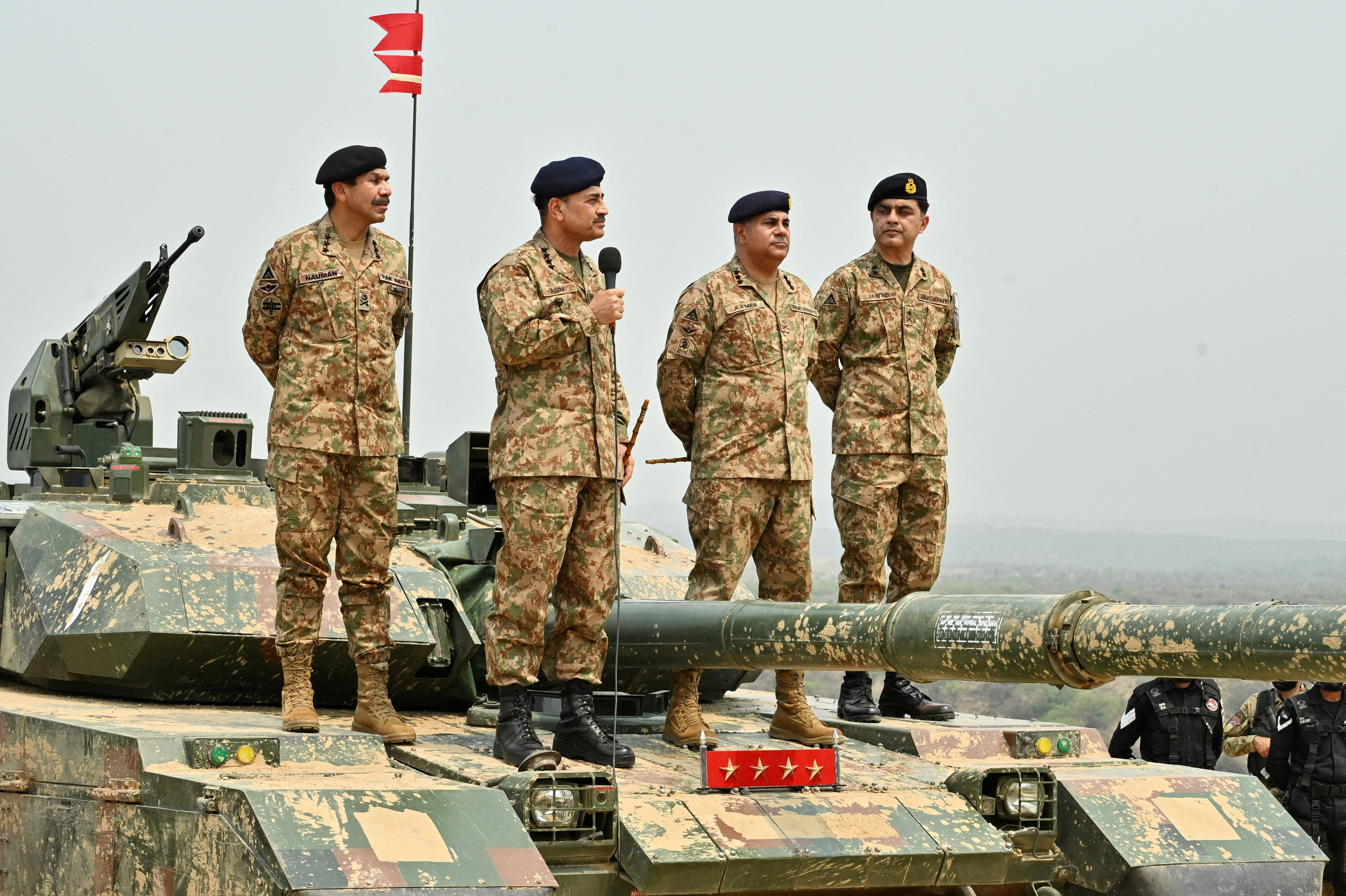 FILE PHOTO: Chief of Army Staff of Pakistan Asim Munir holds a microphone during his visit at the Tilla Field Firing Ranges (TFFR) to witness the Exercise Hammer Strike, a high-intensity field training exercise conducted by the Pakistan Army's Mangla Strike Corps, in Mangla, Pakistan May 1, 2025. Inter-Services Public Relations (ISPR)/Handout via REUTERS THIS IMAGE HAS BEEN SUPPLIED BY A THIRD PARTY/File Photo