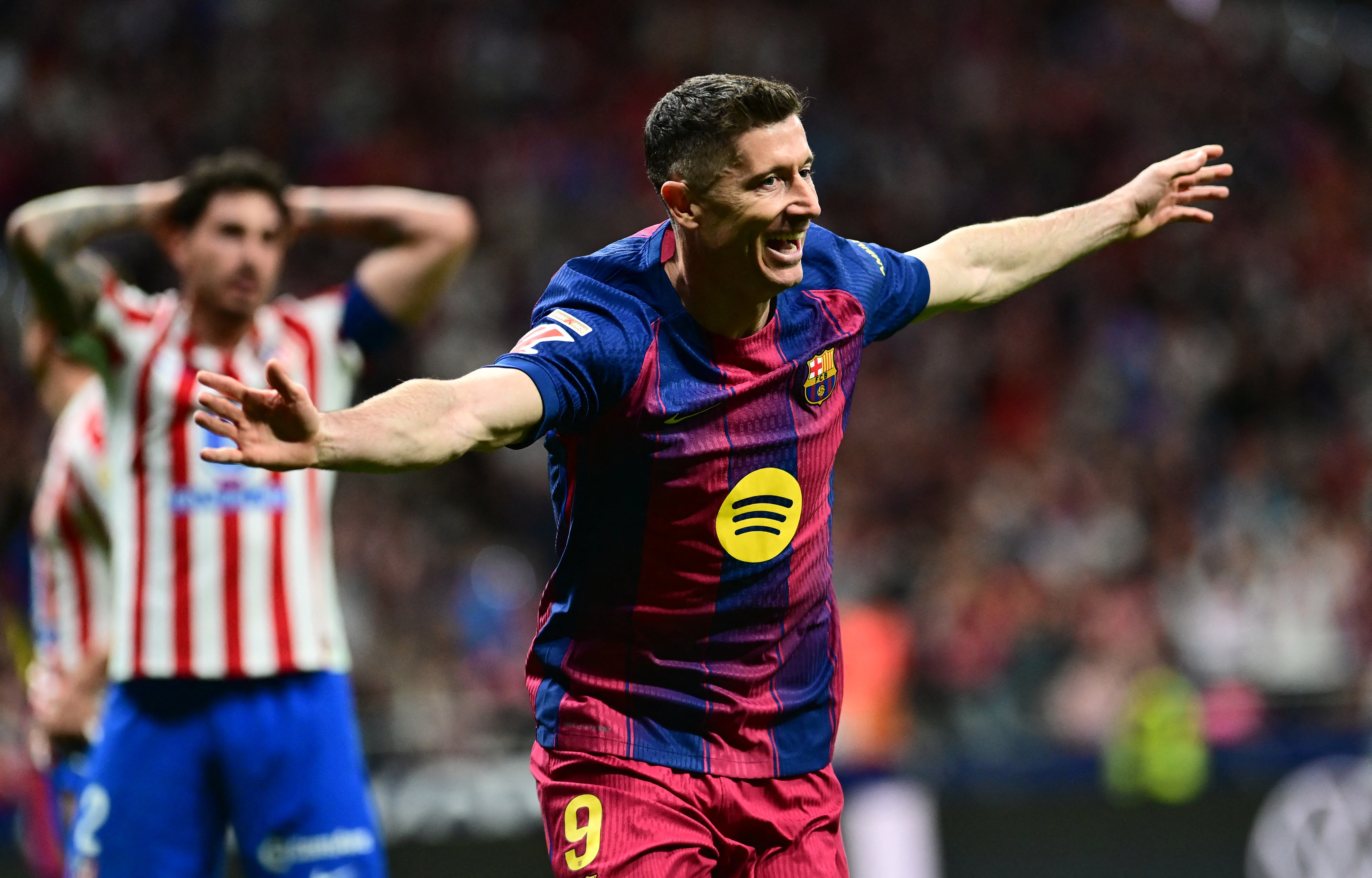 Barcelona's Robert Lewandowski celebrates scoring their second goal