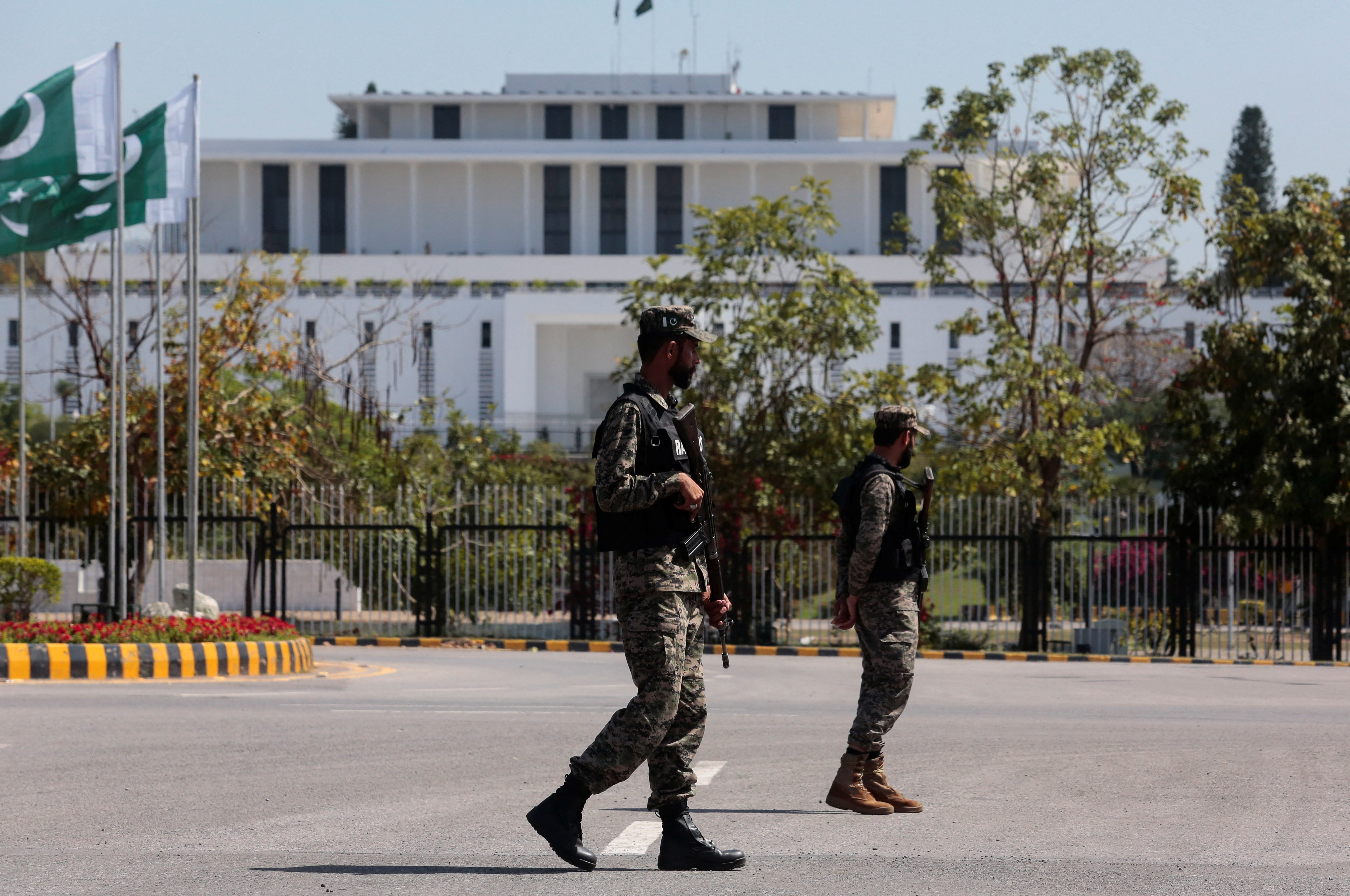 Pakistani Rangers patrol near the president's house.