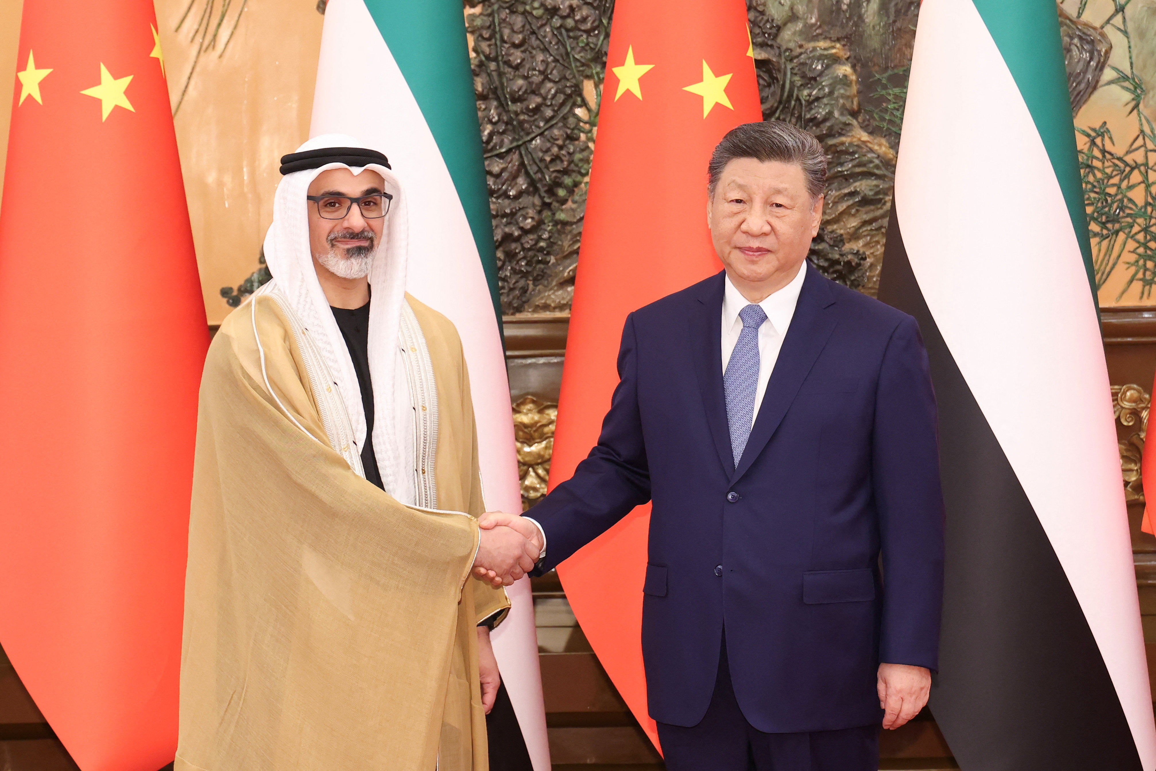 China's President Xi Jinping shakes hands with Sheikh Khaled bin Mohamed bin Zayed Al Nahyan, Crown Prince of Abu Dhabi, United Arab Emirates, in Beijing, China, April 14, 2026. cnsphoto via REUTERS ATTENTION EDITORS - THIS IMAGE WAS PROVIDED BY A THIRD PARTY. CHINA OUT. NO COMMERCIAL OR EDITORIAL SALES IN CHINA