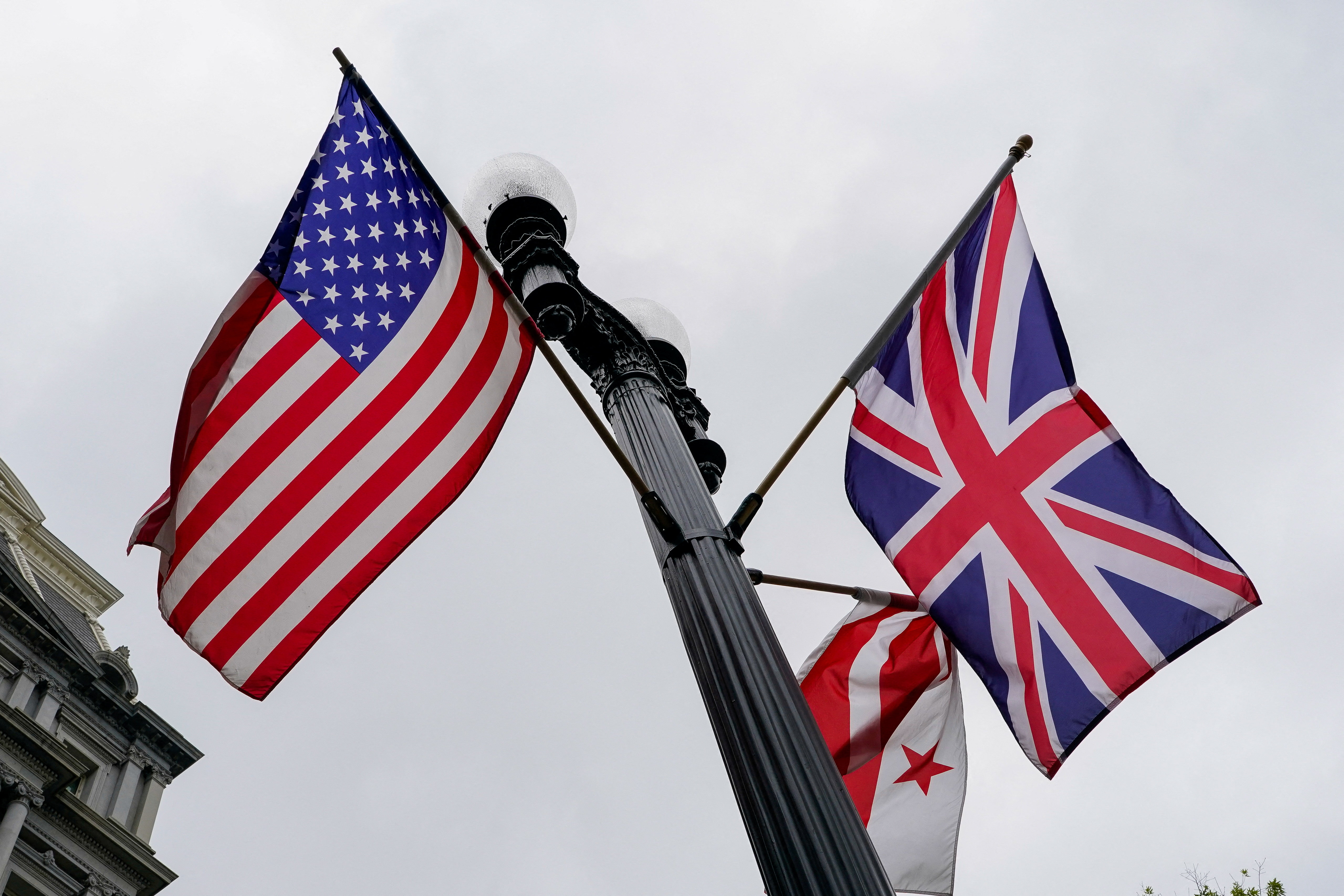 U.S., Union Jack, and Washington, D.C., flags fly in the wind near the White House ahead of Britain’s King Charles and Queen Camilla’s visit to the United States