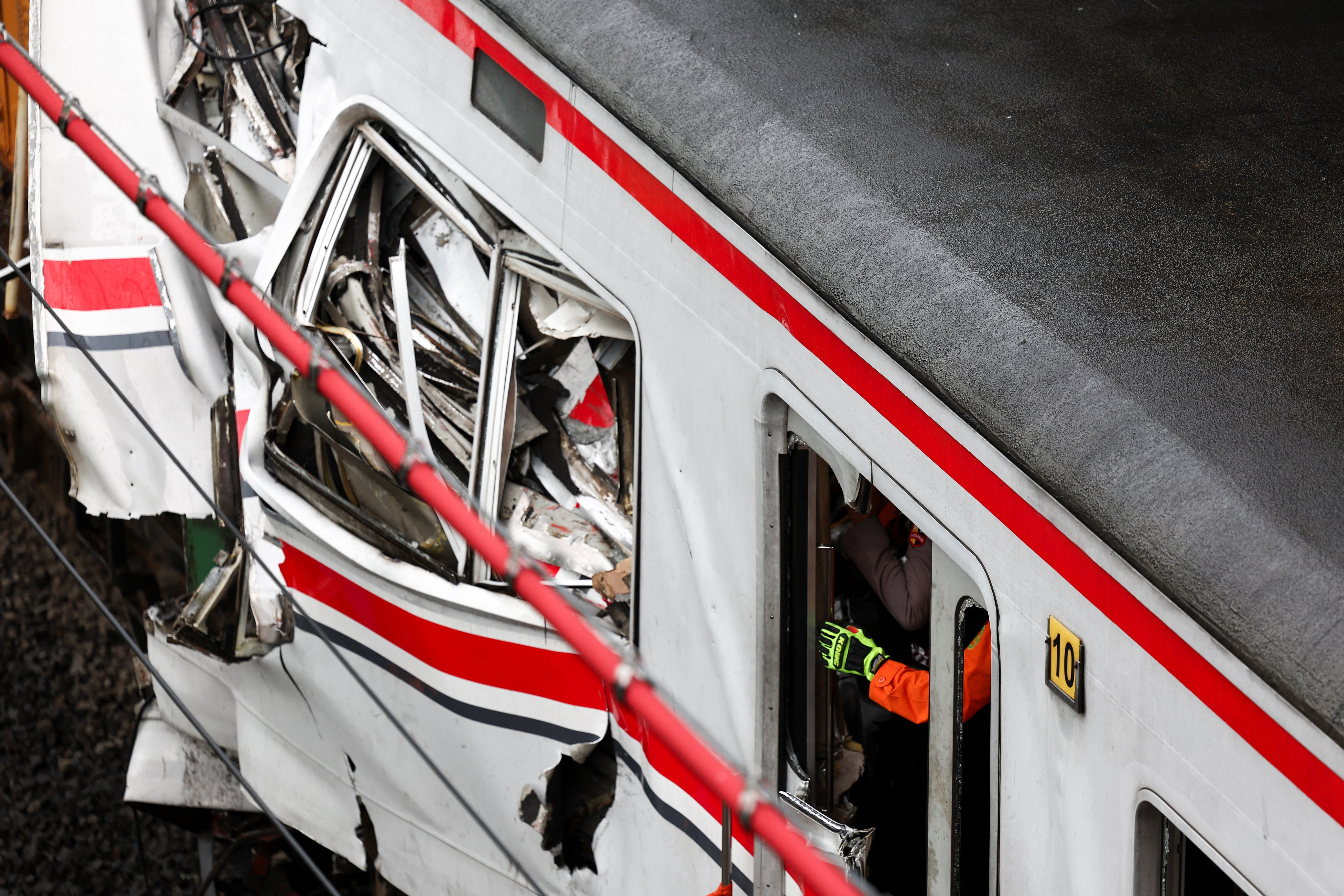 Wreckage after a deadly collision between a commuter line train and a long-distance train, in Bekasi, on the outskirts of Jakarta, Indonesia, April 28, 2026. REUTERS/Willy Kurniawan