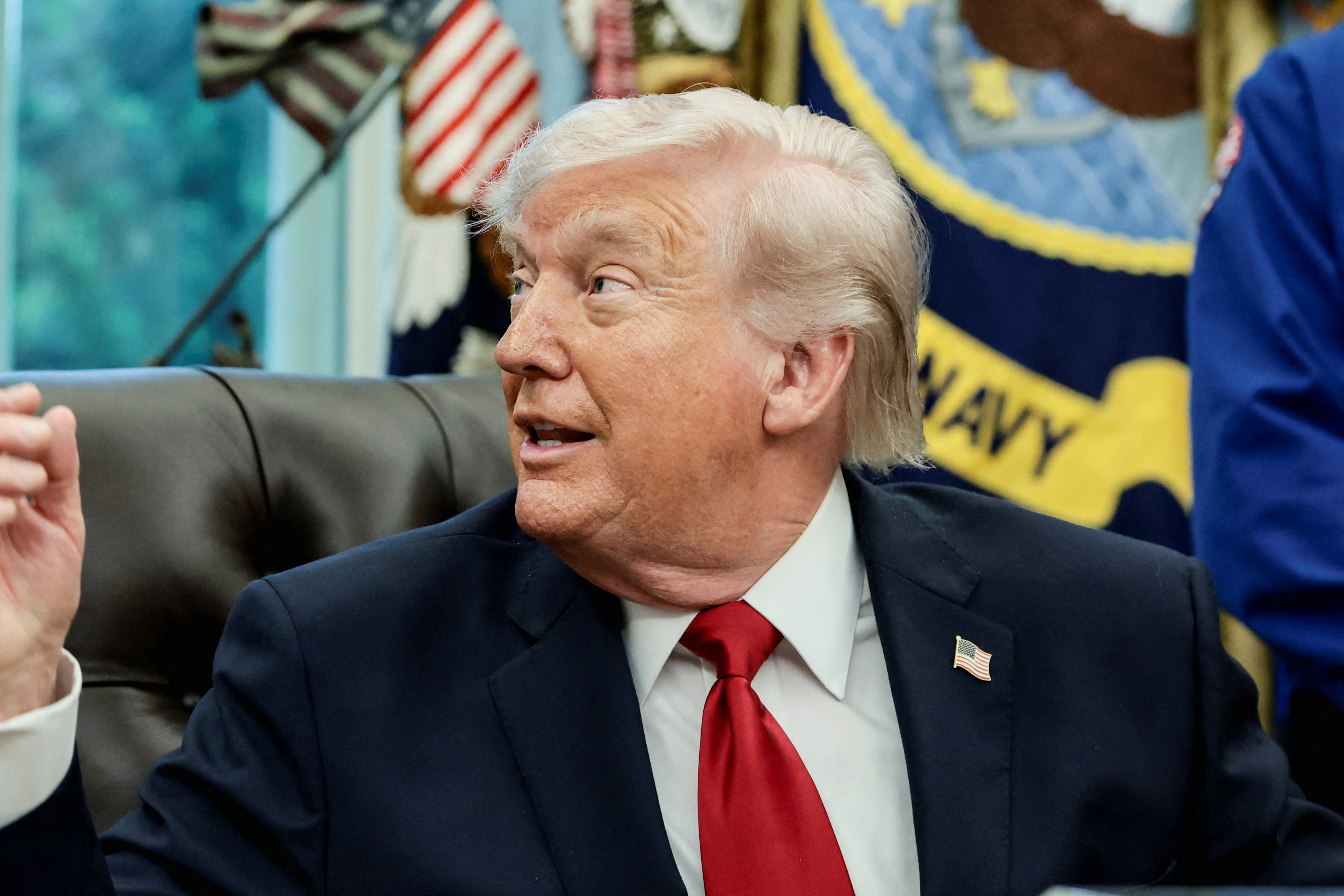 Artemis II astronaut, NASA Mission Specialist Christina Koch, looks at U.S. President Donald Trump as he speaks during an event in the Oval Office at the White House in Washington, D.C., U.S., April 29, 2026. [Evelyn Hockstein/Reuters]