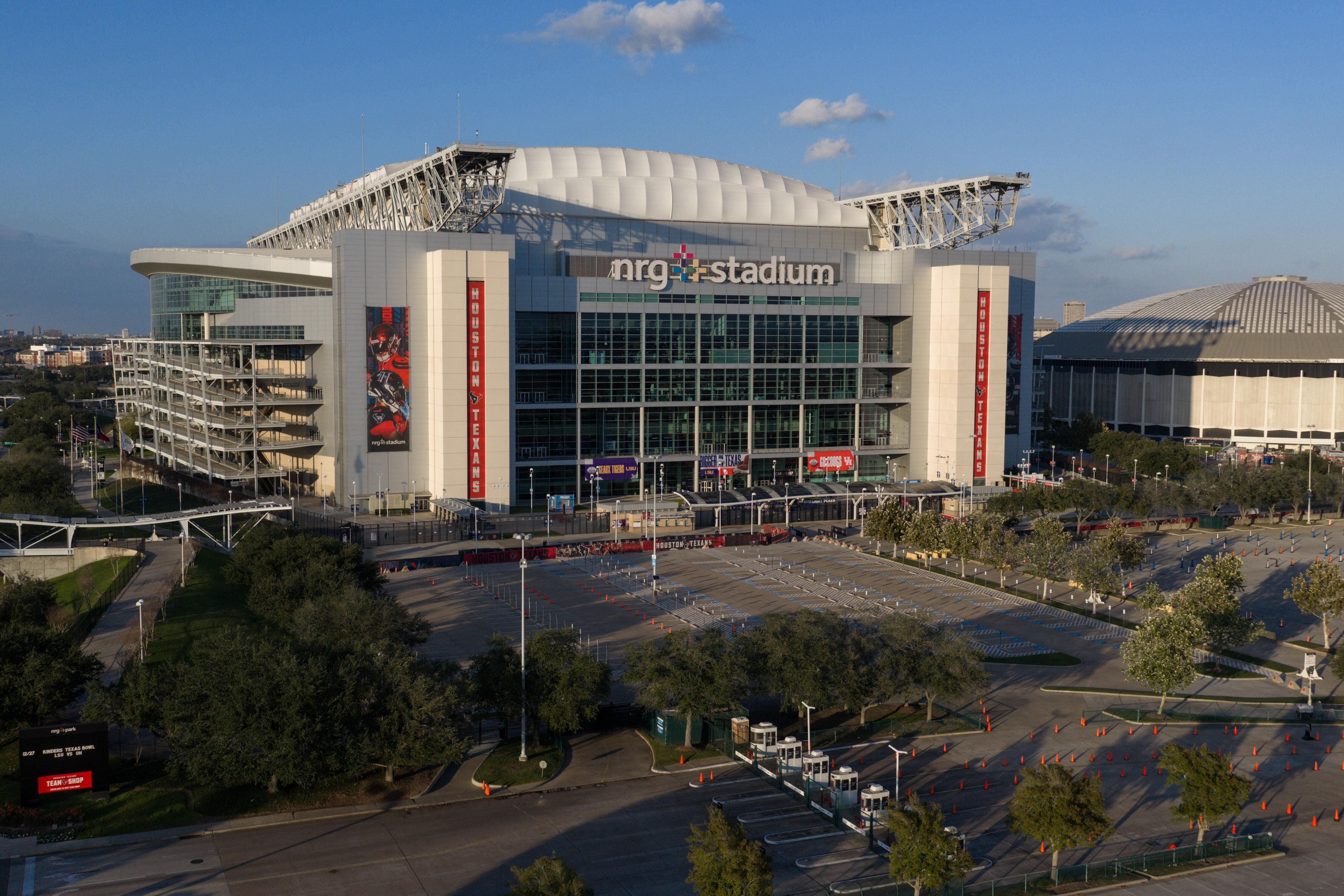 An aerial view of the NRG Stadium, one of the stadiums that will host 2026 FIFA World Cup matches, in Houston, Dec. 24, 2025. The Astrodome is pictured on right. (AP Photo/Jon Shapley)