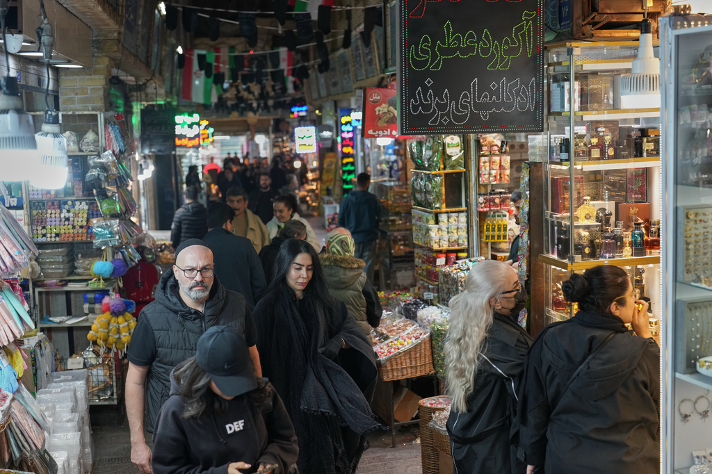People at a market in Tehran