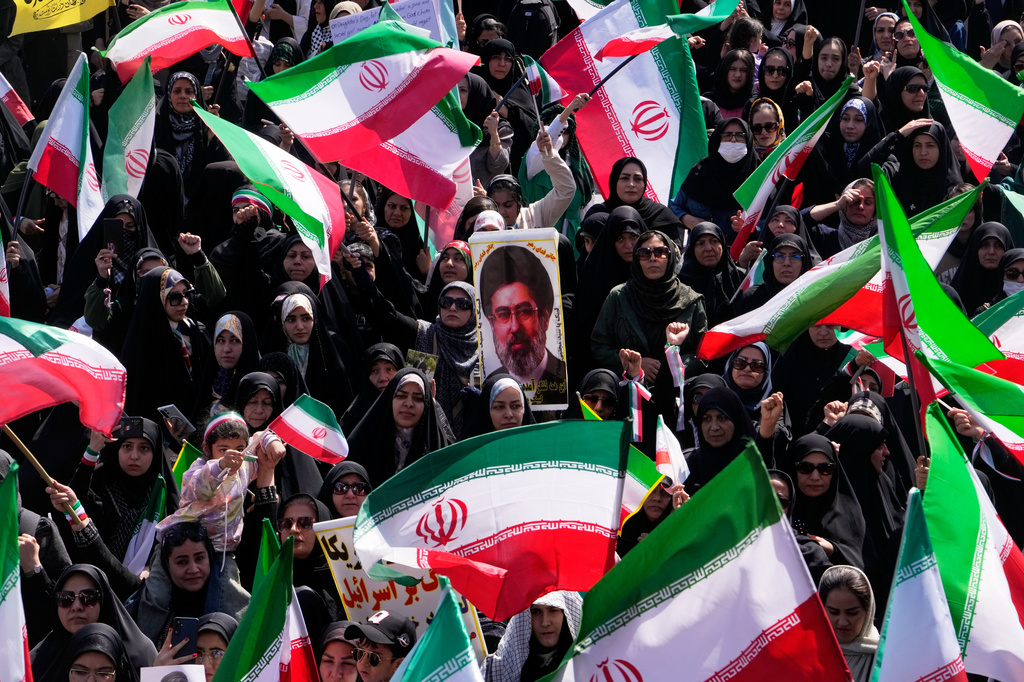Iranian flags with photo of mojtaba