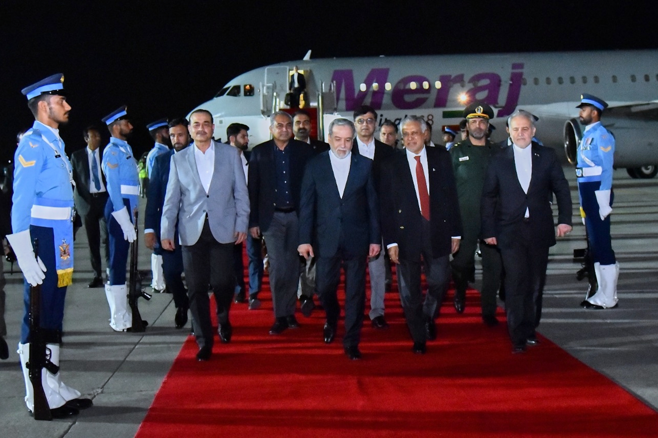 In this photo provided by the Pakistan Ministry of Foreign Affairs, Iranian Foreign Minister Abbas Araghchi, center, is greeted by Pakistan Foreign Minister Ishaq Dar, second right, and Army Chief Field Marshal Asim Munir, third left, upon his arrival at Nur Khan airbase in Rawalpindi, Pakistan, Friday, April 24, 2026. (Pakistan Ministry of Foreign Affairs via AP)