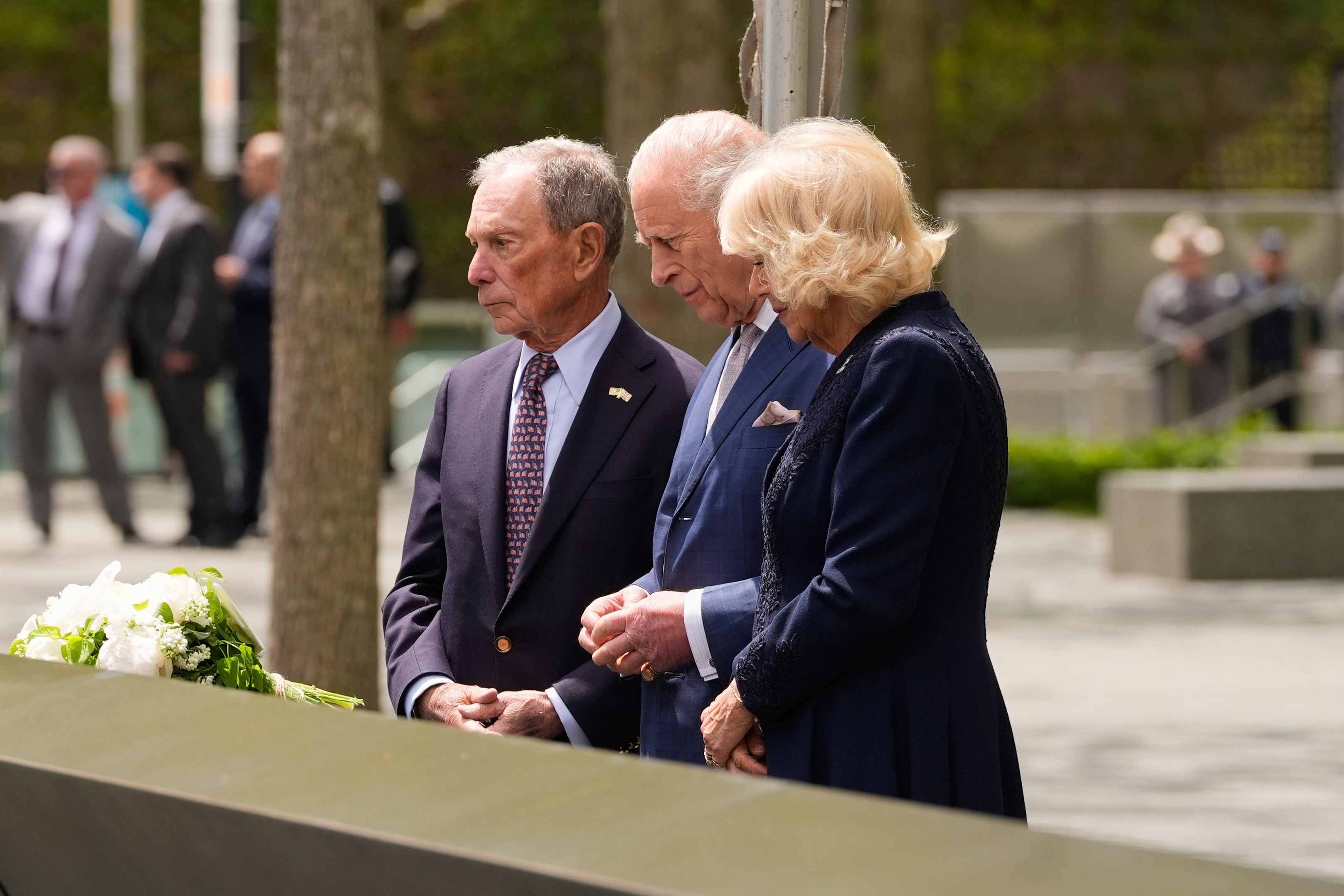 Britain's King Charles III, center, and Queen Camilla, right, visit the 9/11 Memorial with former New York City mayor Michael Bloomberg, Wednesday, April 29, 2026, in New York. [Seth Wenig/AP Photo]