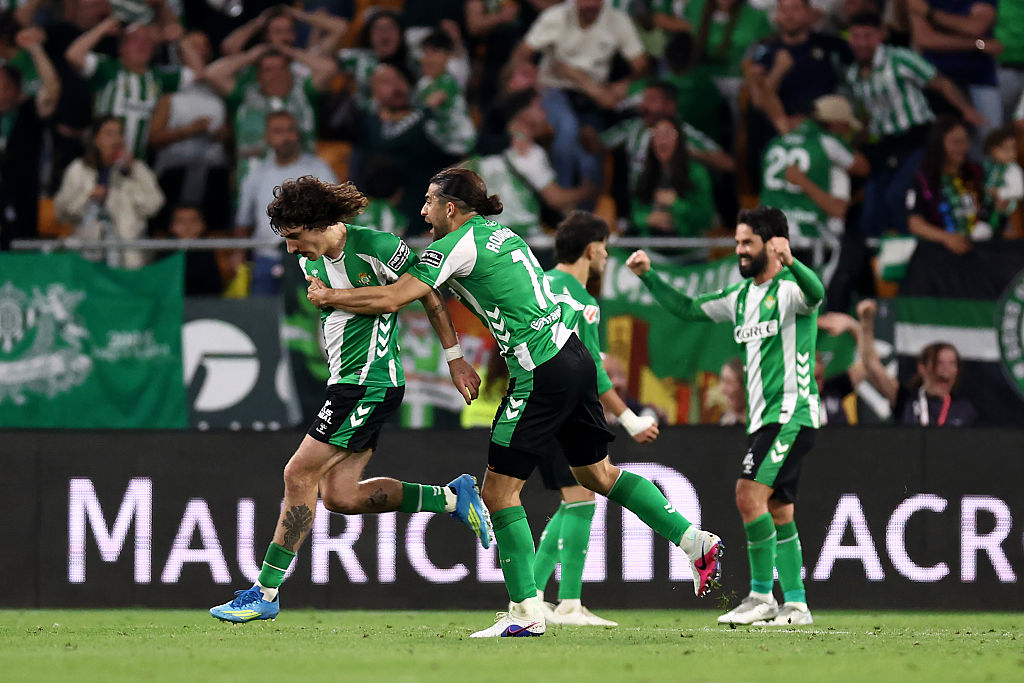 Hector Bellerin of Real Betis celebrates scoring his team's first goal with teammate Ricardo Rodriguez