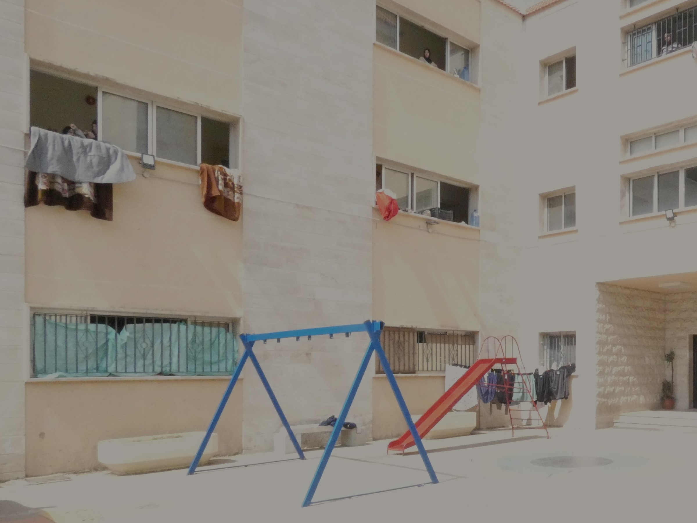 Vacant swings and slides at a school in the Lebanese Mountains.
