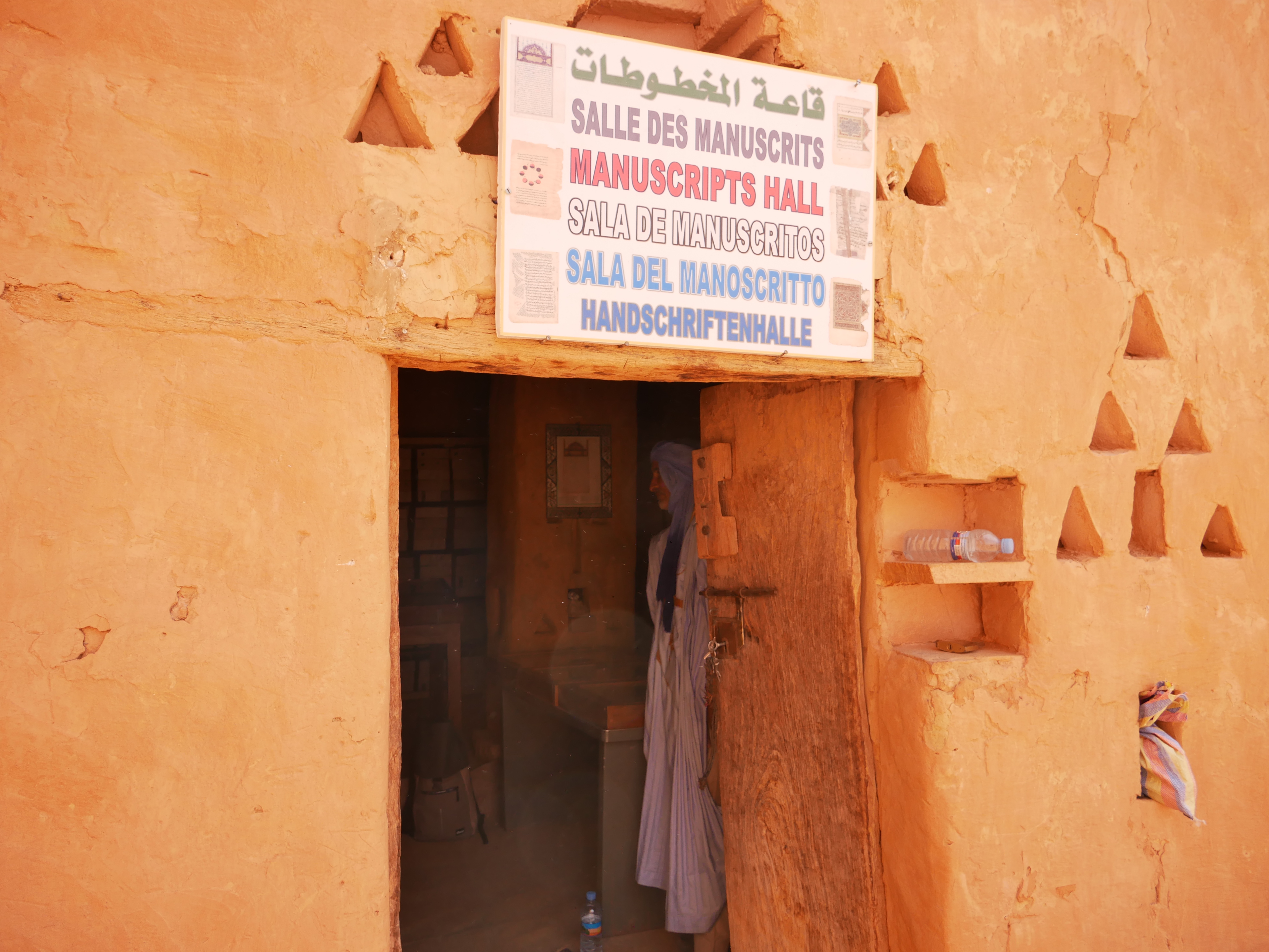 El Habot stands inside the library