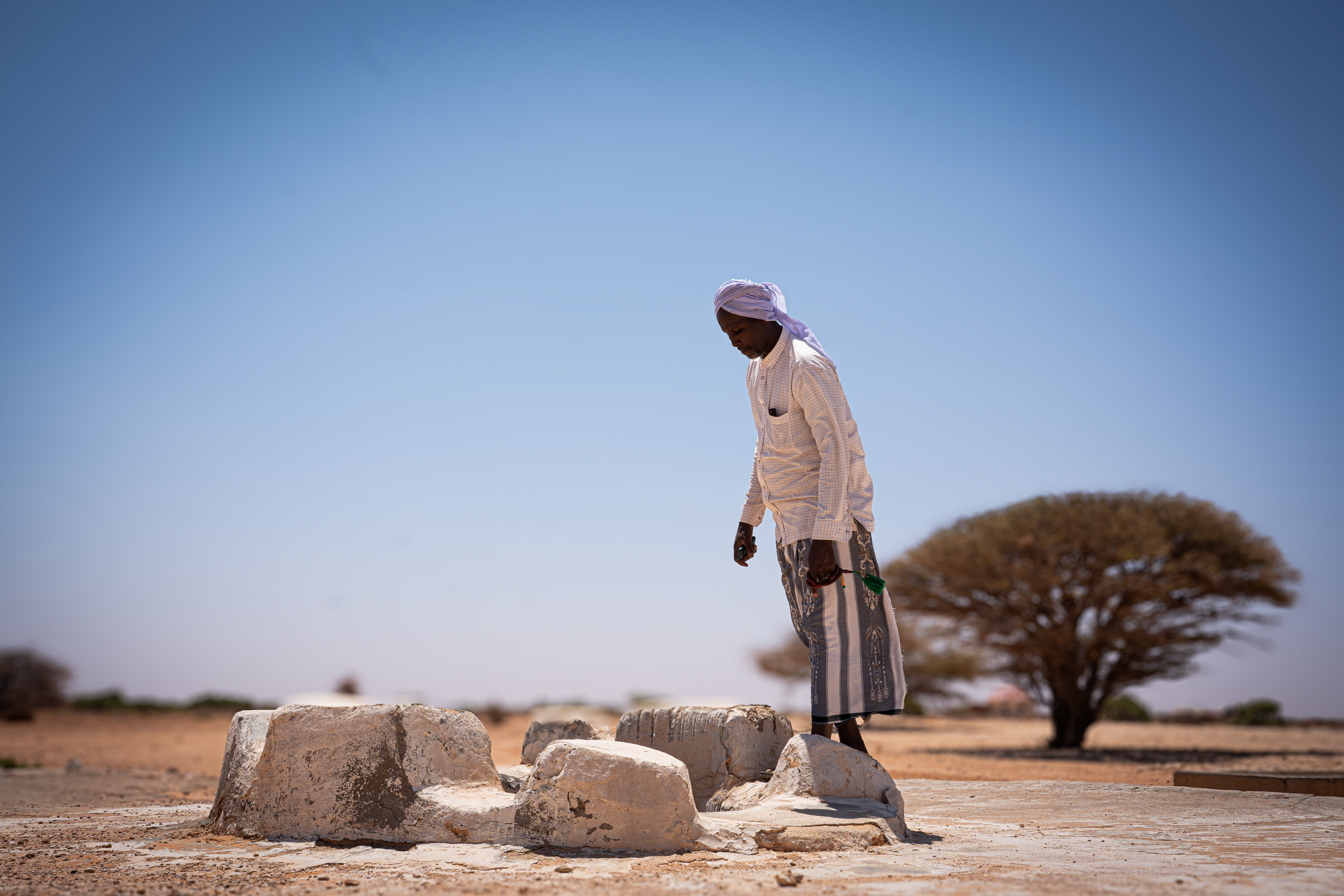 Water sources across rural Somalia have dried up as the drought continues to deepen. Communities are forced to walk for hours in search of water for their families and for the livestock that sustain them. Without water, the last herds die. Without herds, there is nothing left to sell, nothing to eat, and no reason to stay. Bay region, Somalia. [Abdulkadir Mohamed/NRC]