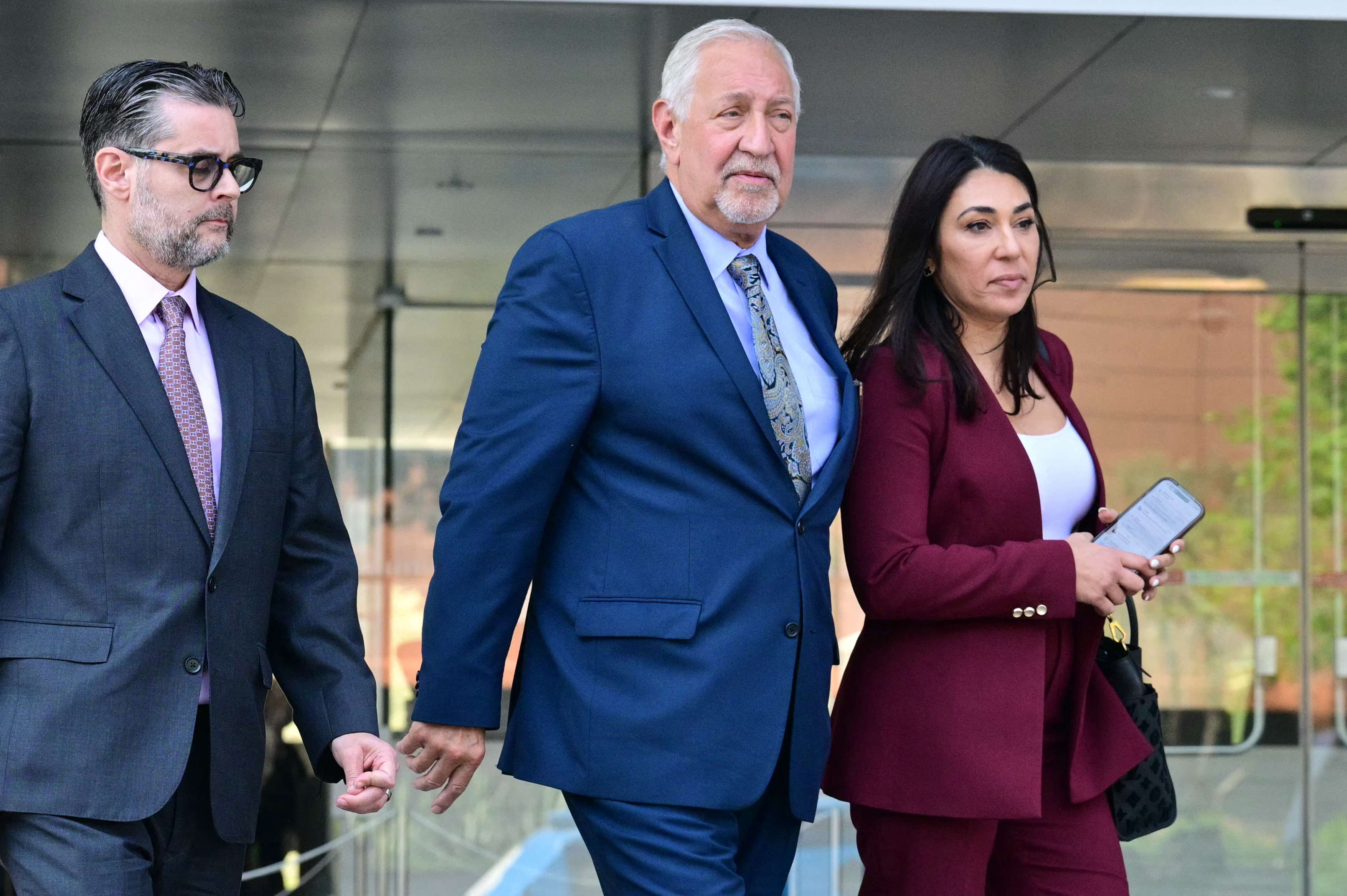 Mark Geragos and Alexandra Kazarian, attorneys for Jasveen Sangha, walk outside the First Street Courthouse in Los Angeles on April 8, 2026.