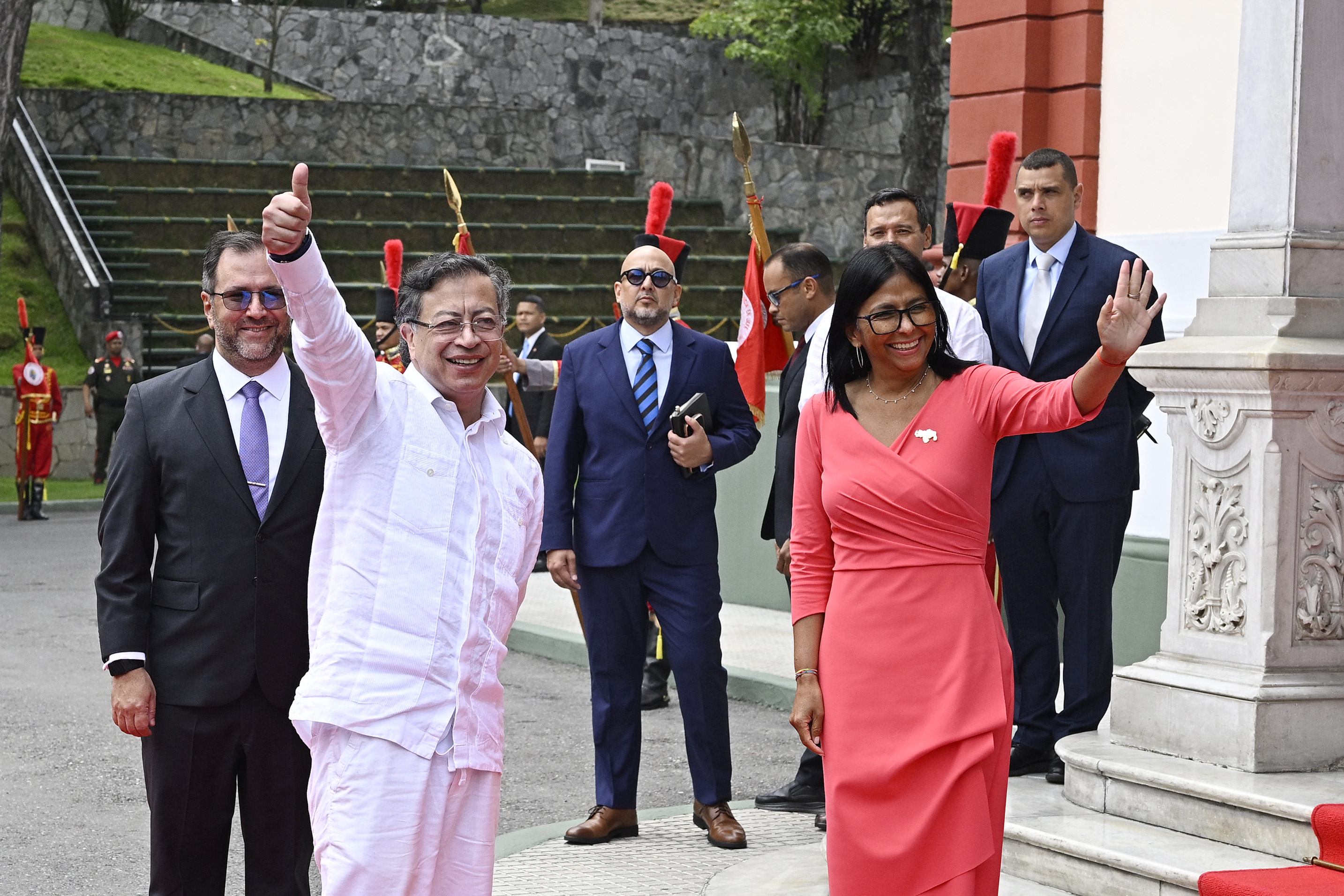 Colombia's President Gustavo Petro and Venezuela's interim President, Delcy Rodriguez, wave upon his arrival to a bilateral meeting at the Miraflores Presidential Palace in Caracas on April 24, 2026.