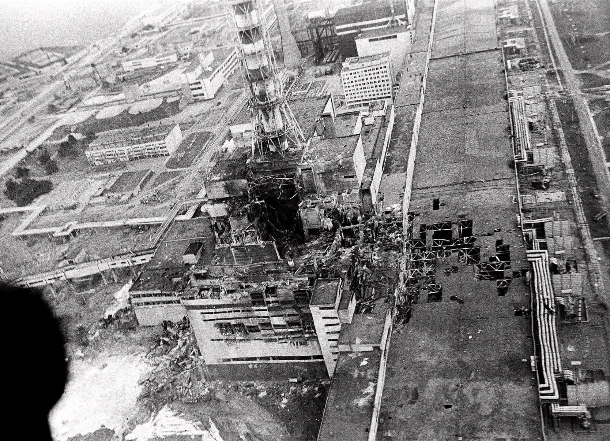 An aerial view of the Chernobyl nucler power plant, the site of the world's worst nuclear accident, is shown in this May 1986 photo made a few days after the April 26 explosion in Chernobyl, Ukraine. In front of the chimney is the destroyed 4th reactor. Behind the chimney and very close to the 4th reactor is the 3rd reactor which was stopped on Dec. 6, 2000. The final shutdown of the Chernobyl nuclear power plant is scheduled for Dec.15, 2000. (AP Photo)