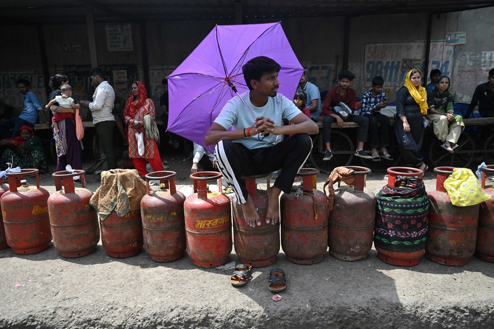 People wait to buy liquefied petroleum gas (LPG) cylinders at a gas agency office in Noida on April 2, 2026 amid ongoing oil and gas import disruptions caused by the US-Israel war on Iran. [Arun Sankar/AFP]
