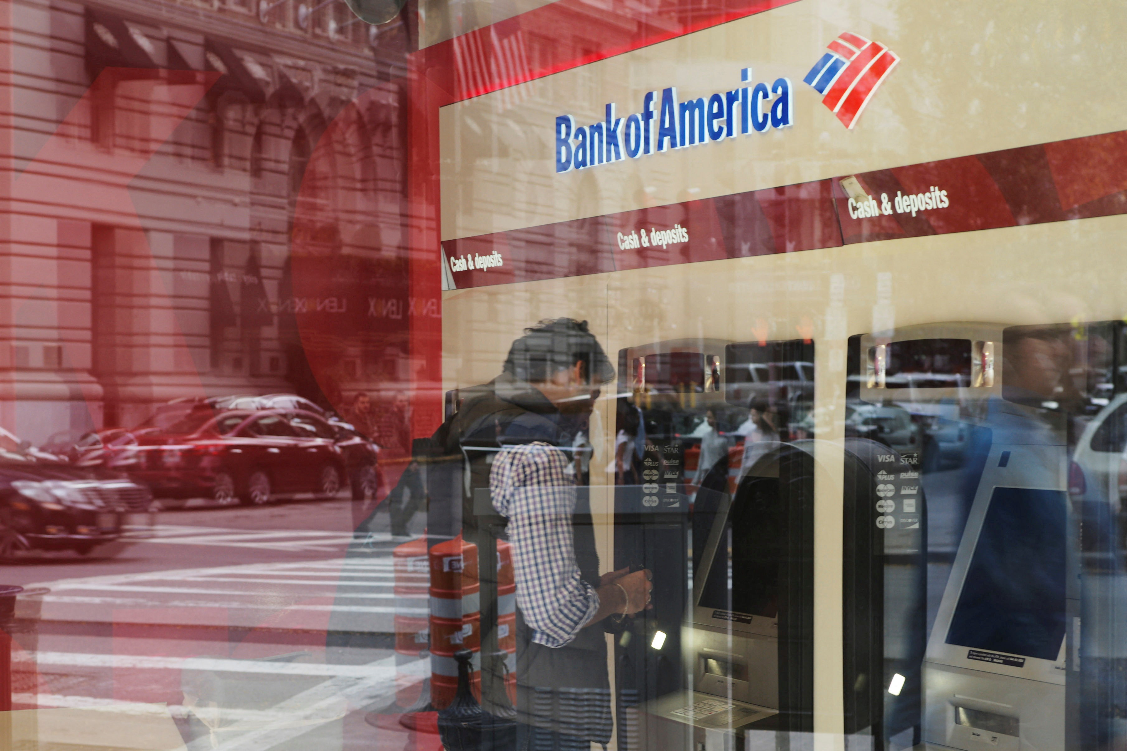 FILE PHOTO: A customer uses an ATM at a Bank of America branch in Boston, Massachusetts, U.S., October 11, 2017. REUTERS/Brian Snyder/File Photo