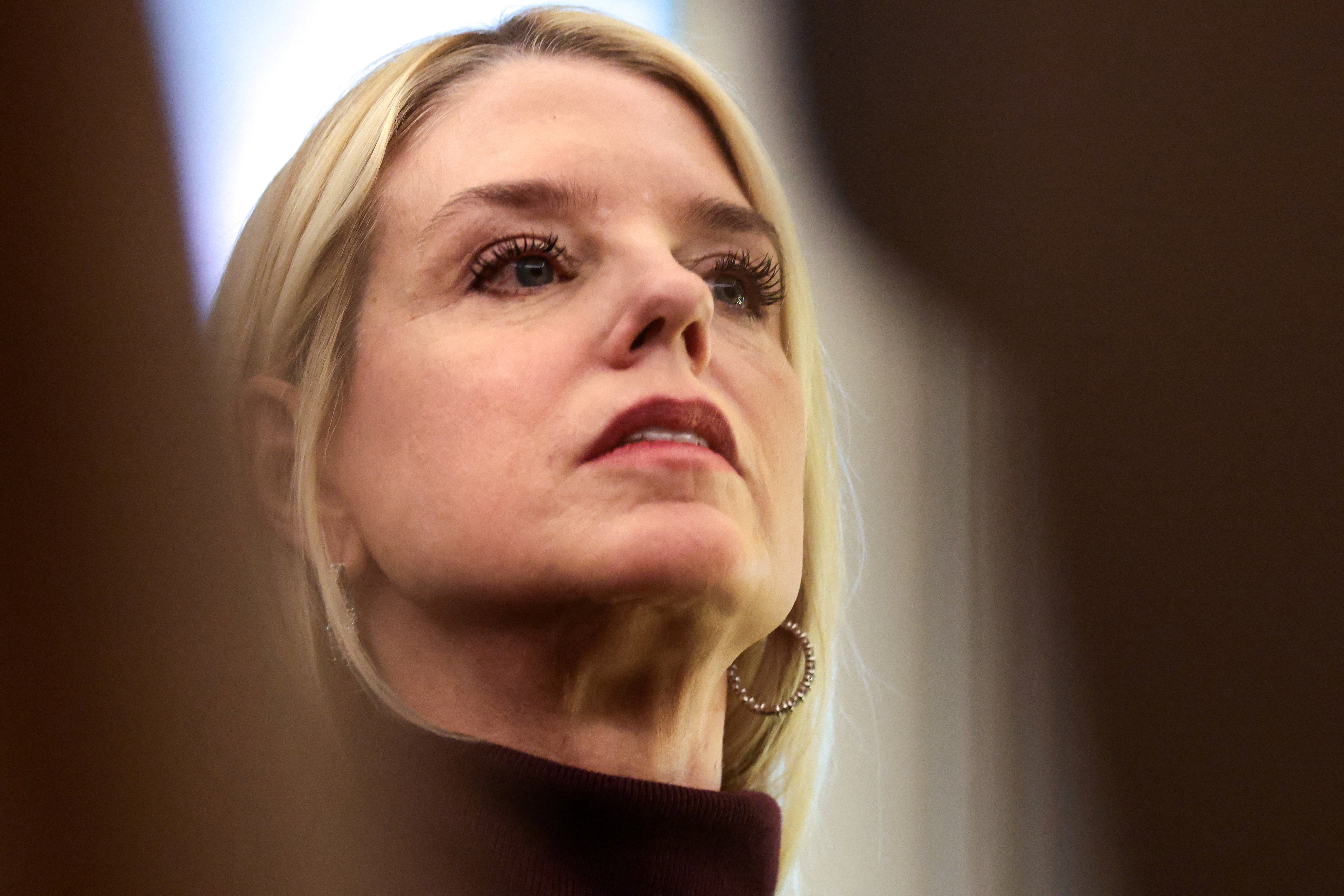 FILE PHOTO: U.S. Attorney General Pam Bondi attends a Mexican Border Defense Medal presentation in the Oval Office at the White House in Washington, D.C., U.S., December 15, 2025. REUTERS/Evelyn Hockstein/File Photo