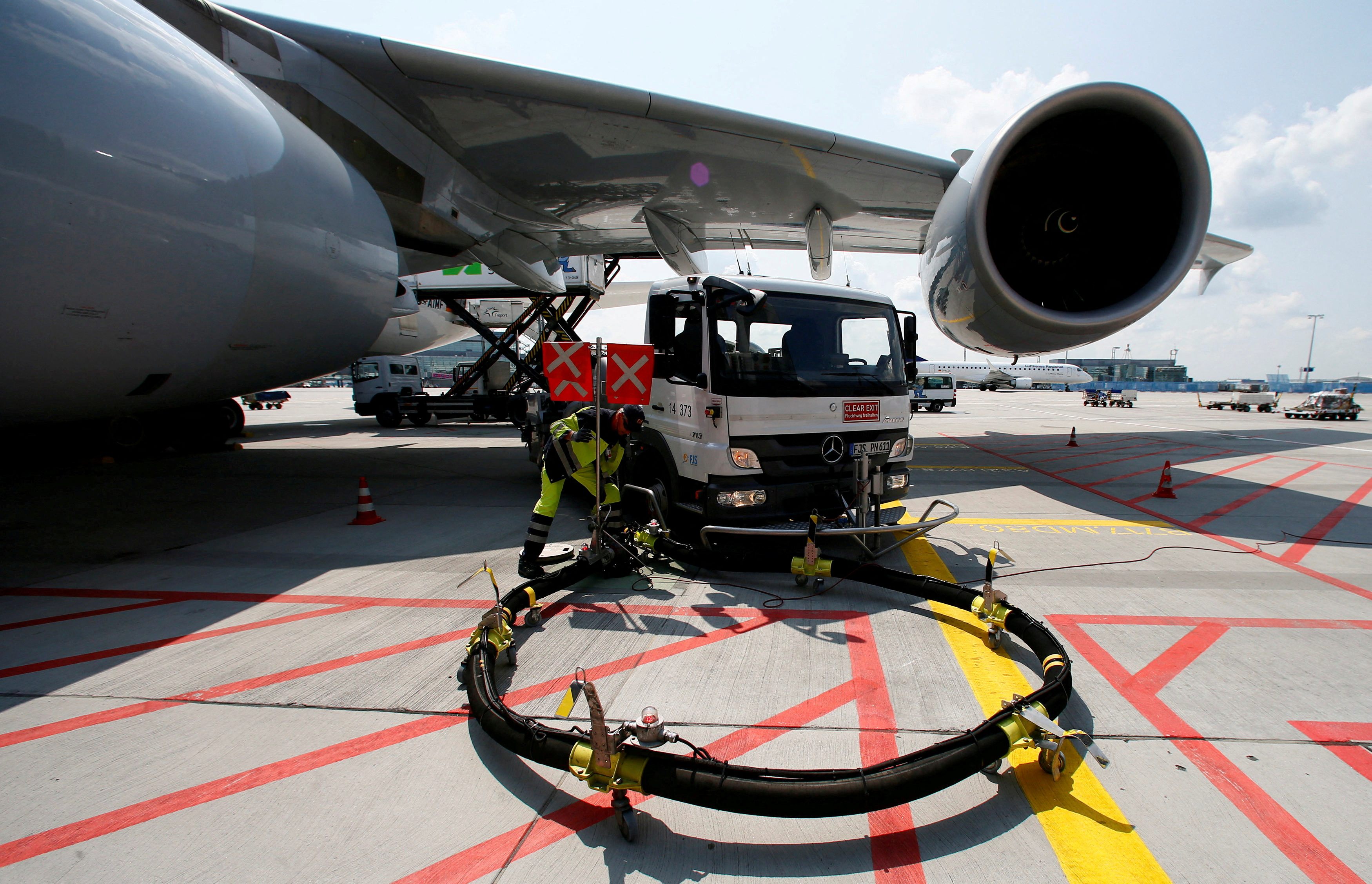 FILE PHOTO: A Lufthansa Airbus 380 is refuelled in Frankfurt airport July 12, 2013. REUTERS/Ralph Orlowski/File Photo