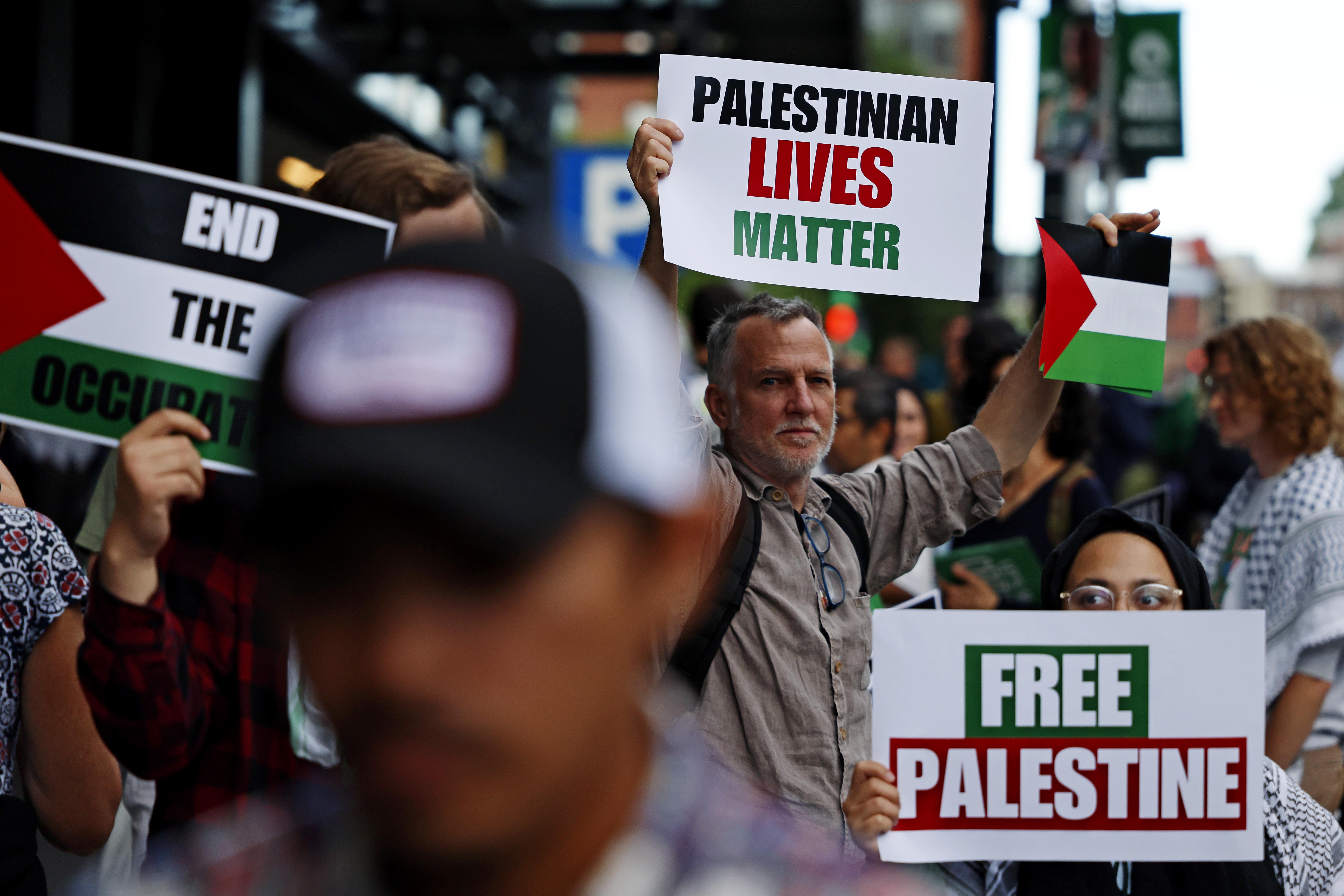 Jun 9, 2024; Boston, Massachusetts, USA; Protesters hold up sign in support of Palestine before outside if TD Garden game two of the 2024 NBA Finals between the Boston Celtics and the Dallas Mavericks at TD Garden. Mandatory Credit: Peter Casey-USA TODAY Sports