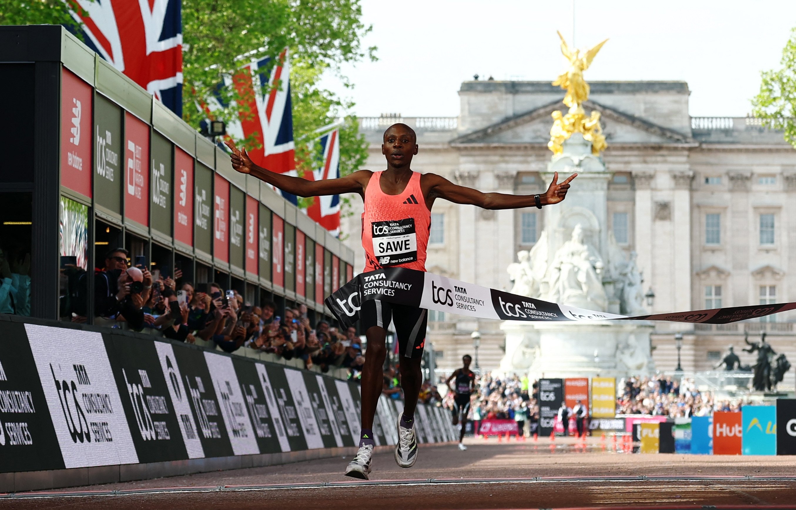 Kenya's Sabastian Sawe crosses the finish line to win the men's elite race.