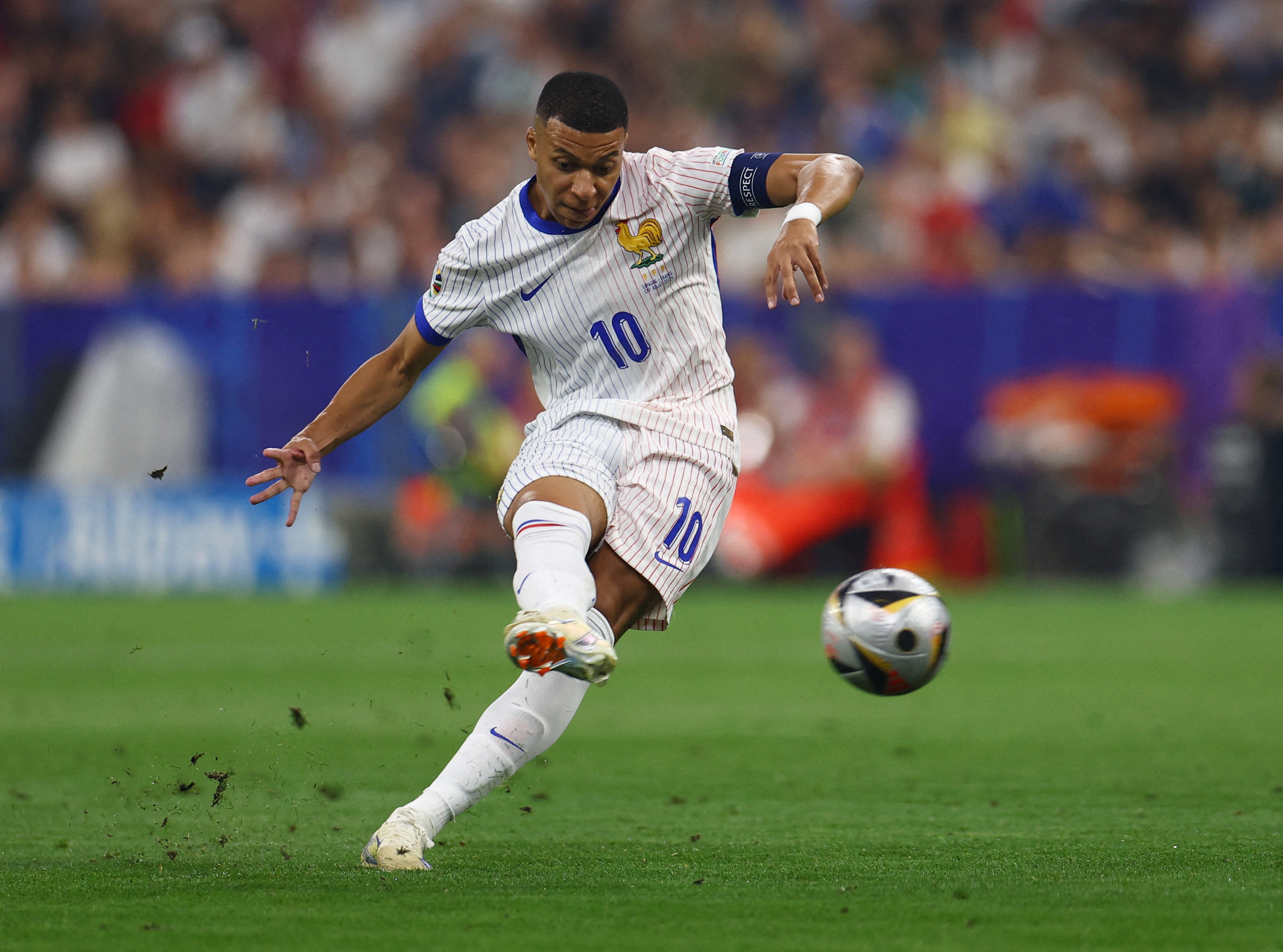 France's Kylian Mbappe shoots at goal