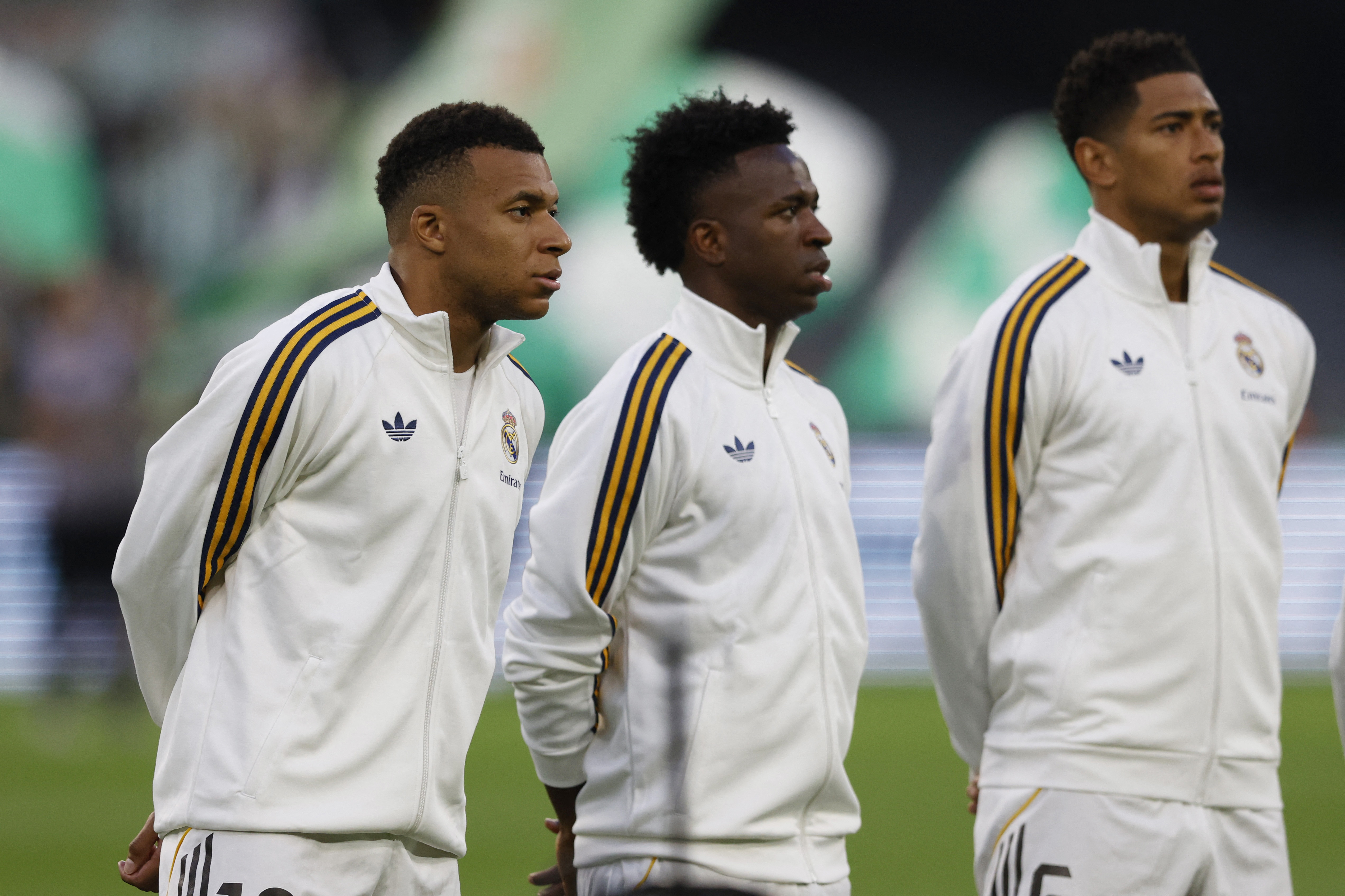 Real Madrid's Kylian Mbappe, Vinicius Junior and Jude Bellingham line up before a La Liga match 
