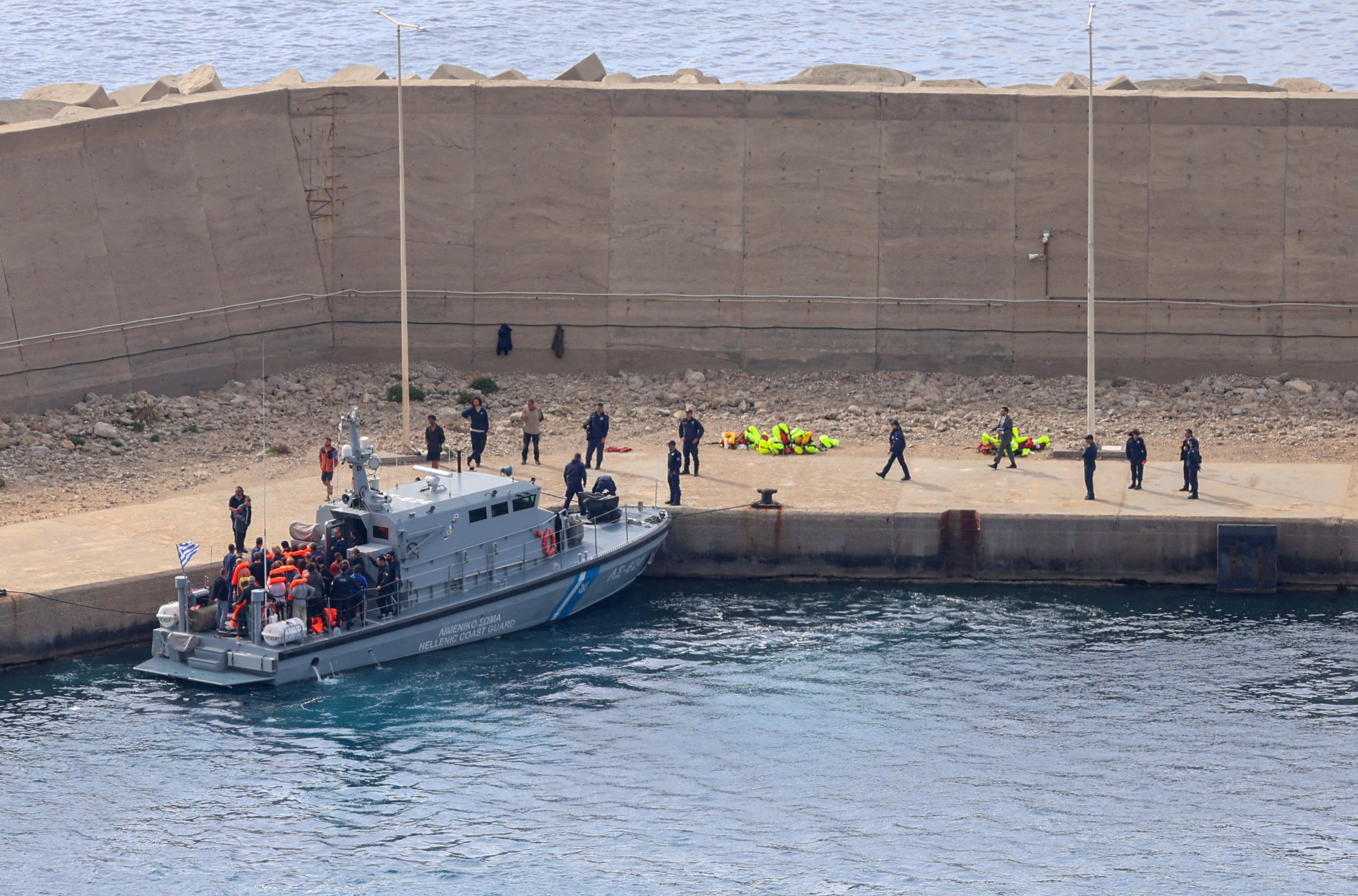A Greek coastguard vessel transfers activists at the port of Atherinolakkos, on the island of Crete, Greece