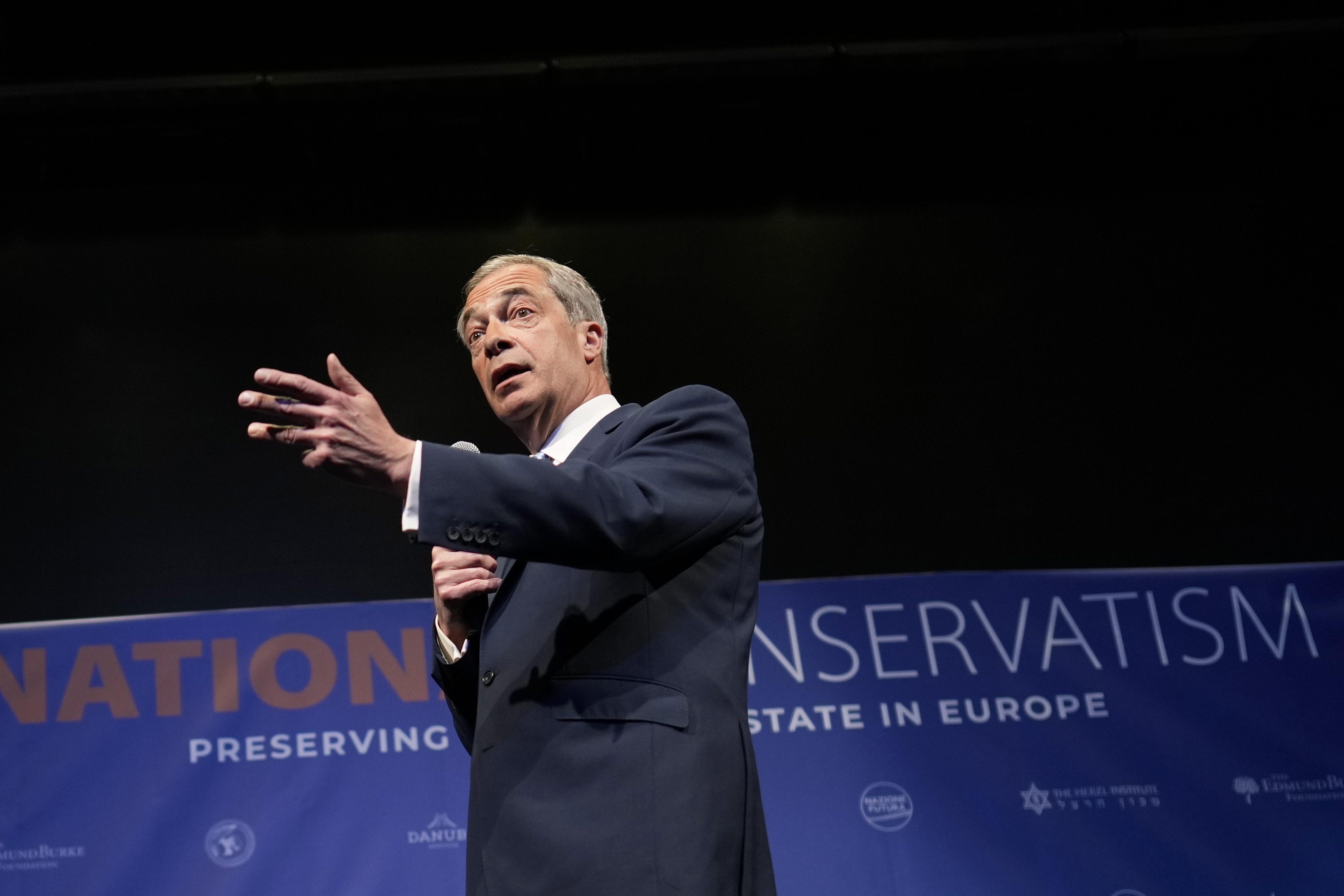 Former MEP and Honorary President of the Reform UK party Nigel Farage speaks during the National Conservatism conference in Brussels, Tuesday, April 16, 2024. (AP Photo/Virginia Mayo)