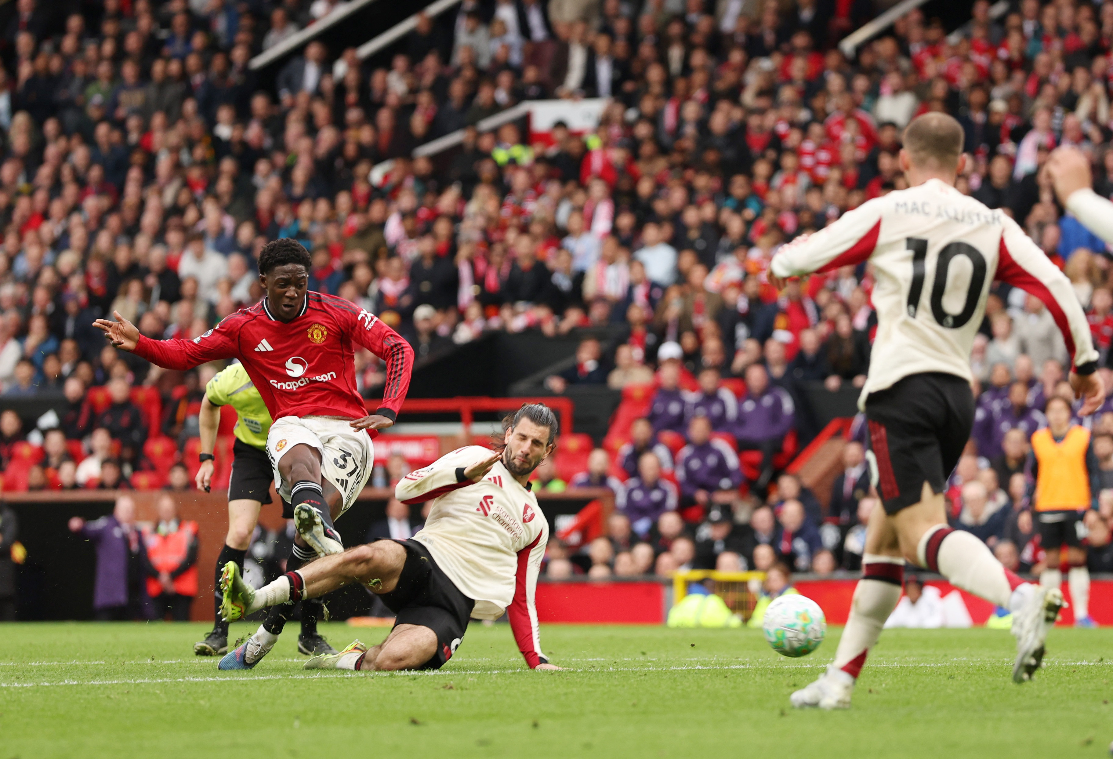 Soccer Football - Premier League - Manchester United v Liverpool - Old Trafford, Manchester, Britain - May 3, 2026 Manchester United's Kobbie Mainoo scores their third goal REUTERS/Chris Radburn EDITORIAL USE ONLY. NO USE WITH UNAUTHORIZED AUDIO, VIDEO, DATA, FIXTURE LISTS, CLUB/LEAGUE LOGOS OR 'LIVE' SERVICES. ONLINE IN-MATCH USE LIMITED TO 120 IMAGES, NO VIDEO EMULATION. NO USE IN BETTING, GAMES OR SINGLE CLUB/LEAGUE/PLAYER PUBLICATIONS. PLEASE CONTACT YOUR ACCOUNT REPRESENTATIVE FOR FURTHER DETAILS..