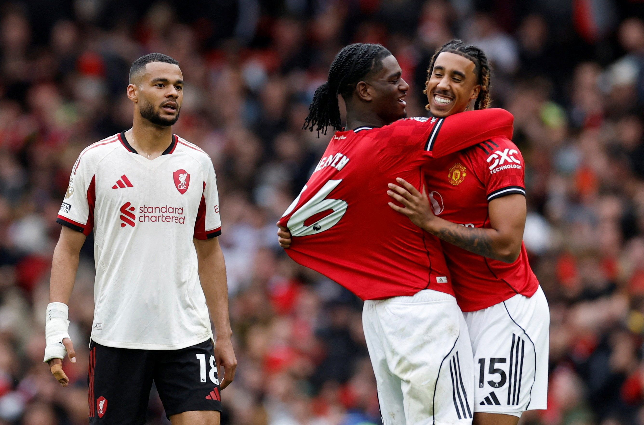 Soccer Football - Premier League - Manchester United v Liverpool - Old Trafford, Manchester, Britain - May 3, 2026 Manchester United's Ayden Heaven and Leny Yoro celebrate as Liverpool's Cody Gakpo looks dejected after the match Action Images via Reuters/Jason Cairnduff EDITORIAL USE ONLY. NO USE WITH UNAUTHORIZED AUDIO, VIDEO, DATA, FIXTURE LISTS, CLUB/LEAGUE LOGOS OR 'LIVE' SERVICES. ONLINE IN-MATCH USE LIMITED TO 120 IMAGES, NO VIDEO EMULATION. NO USE IN BETTING, GAMES OR SINGLE CLUB/LEAGUE/PLAYER PUBLICATIONS. PLEASE CONTACT YOUR ACCOUNT REPRESENTATIVE FOR FURTHER DETAILS.. TPX IMAGES OF THE DAY