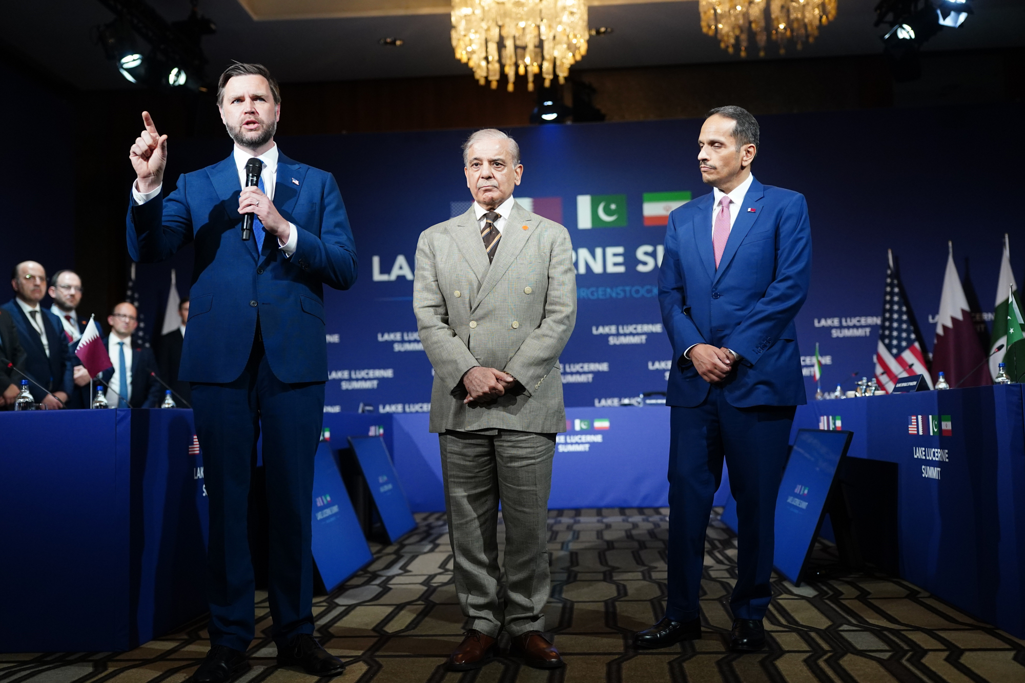 U.S. Vice President JD Vance, left, makes an opening statement next to Pakistan's Prime Minister Shehbaz Sharif, center, and Qatar's Prime Minister and Minister for Foreign Affairs Sheikh Mohammed bin Abdulrahman bin Jassim Al-Thani, at the Bürgenstock Resort in Obbuergen, Switzerland, Sunday, June 21, 2026.
