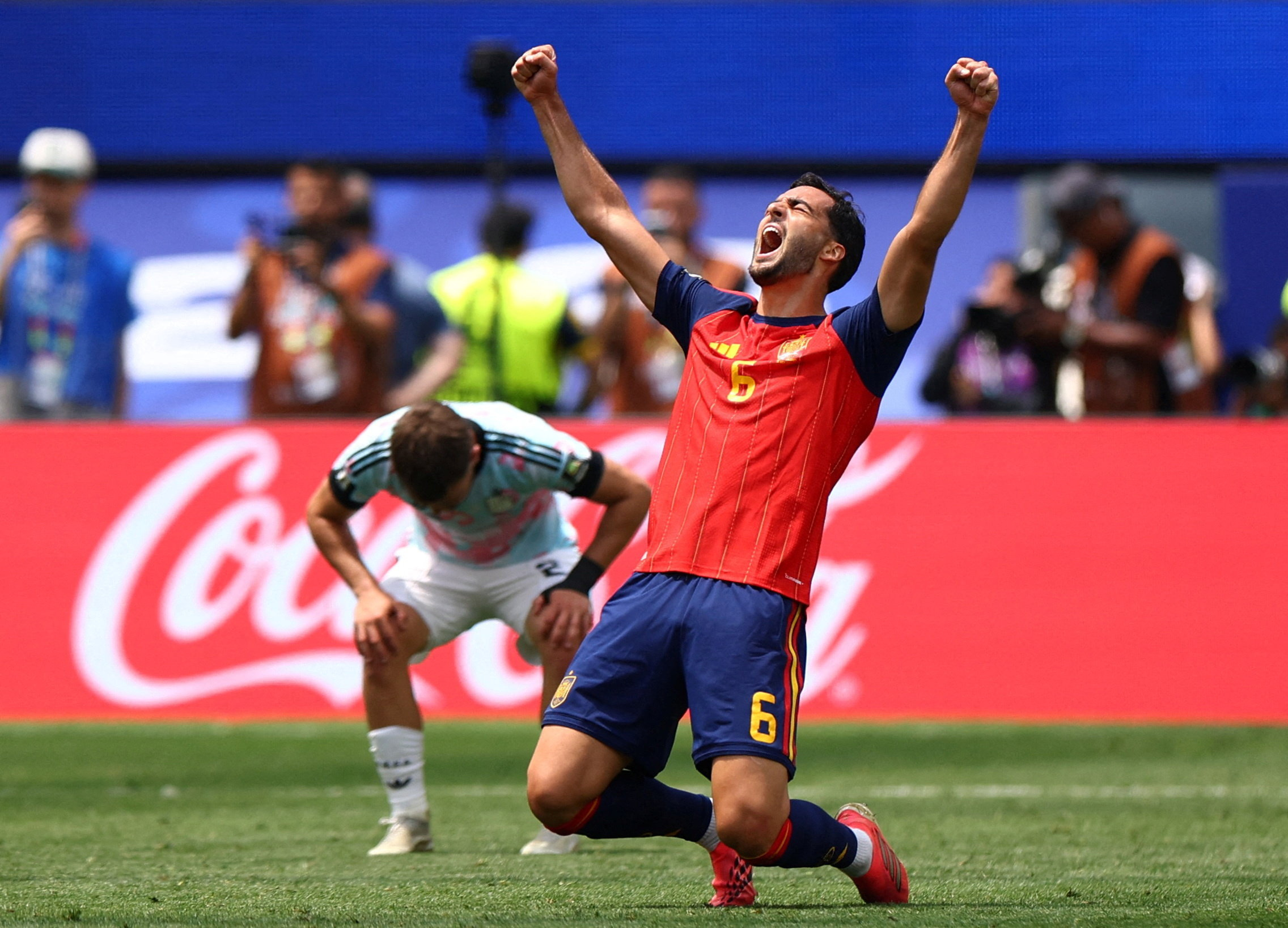 Spain's Mikel Merino celebrates after the match