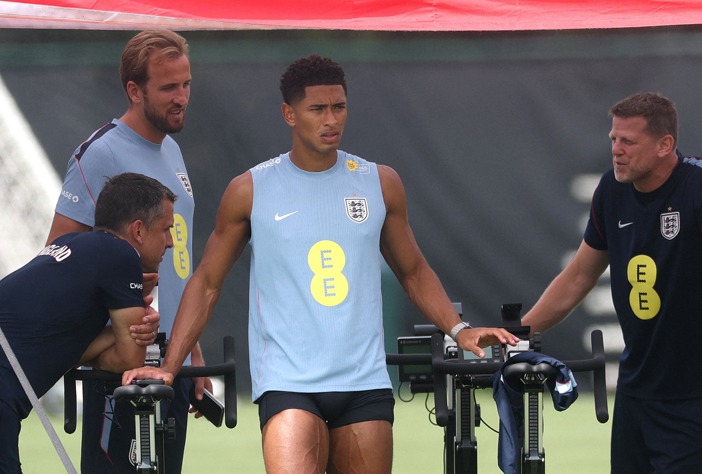 England’s Harry Kane, second from left, and Jude Bellingham look on during training in Kansas City before departing for Mexico