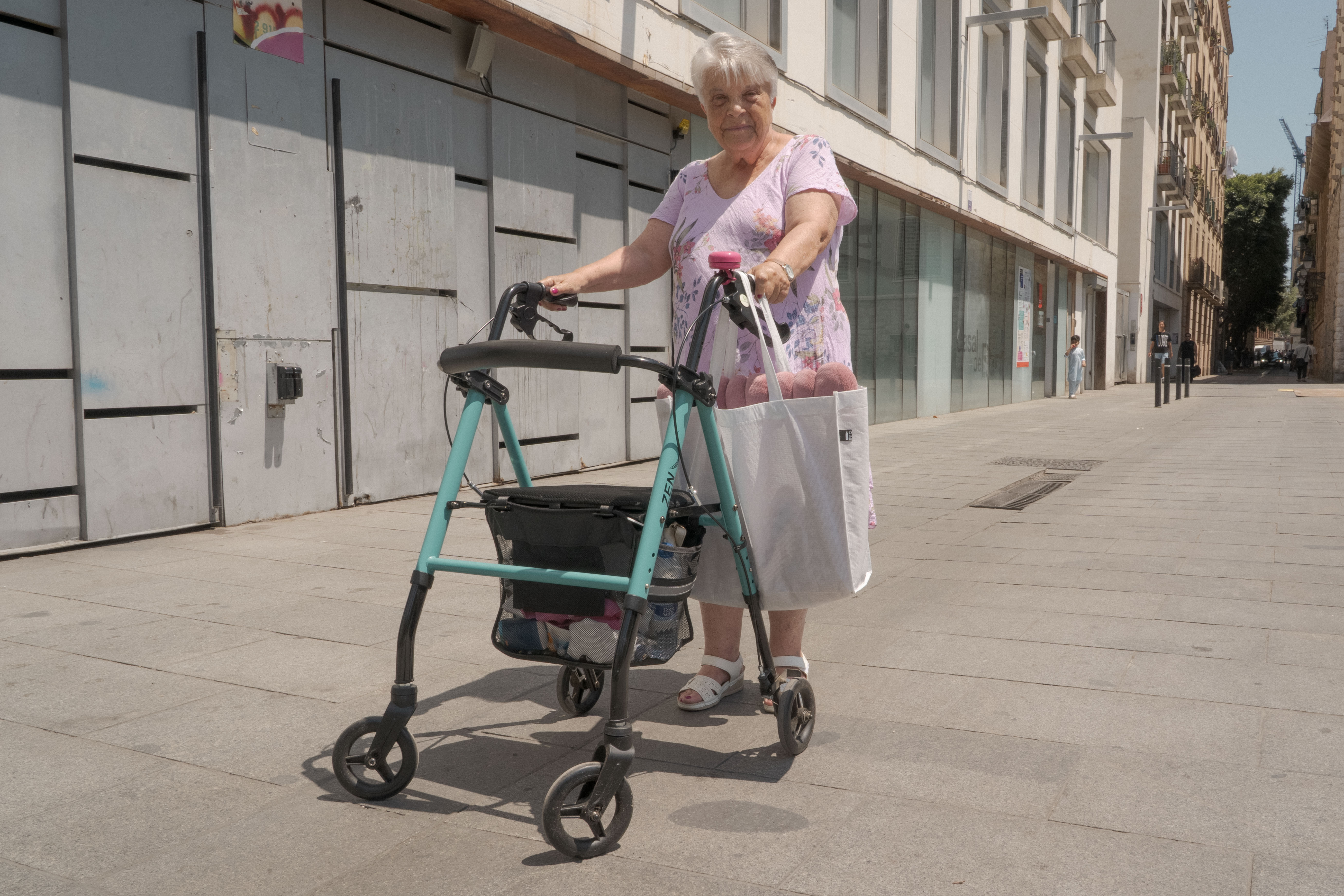 Margarita Medina, 70, has lived in El Raval her whole life. She lives alone and says the heat is especially hard on her because of a lung condition