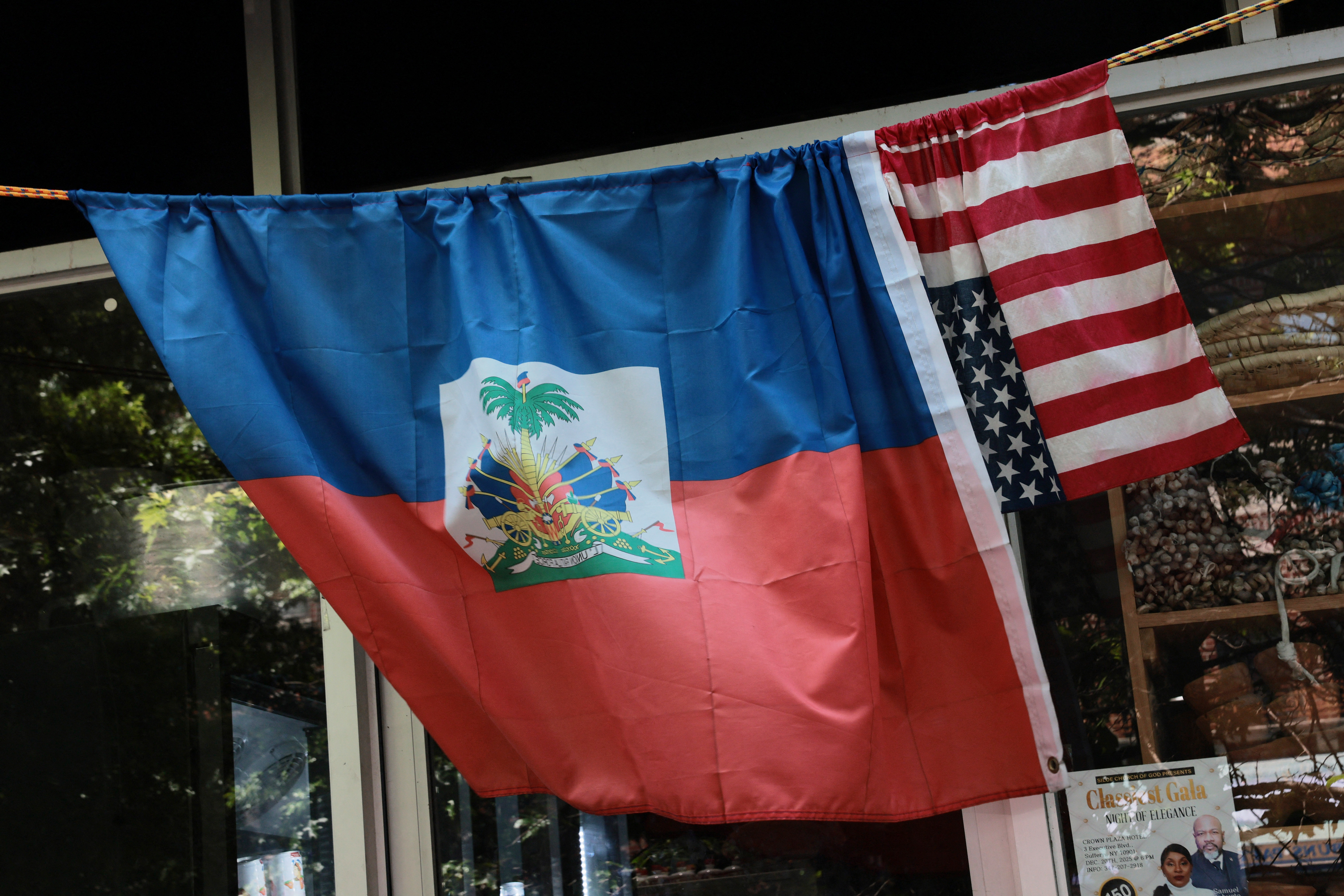 NEW YORK, NEW YORK - JUNE 25: Haitian flags are displayed on a store on June 25, 2026 in the Little Haiti neighborhood of the Brooklyn borough in New York City. In a 6-3 ruling, the Supreme Court ruled in favor of the Trump administration’s effort to strip temporary protected status (TPS) from hundreds of thousands of Haitians and Syrians, who were legally in the U.S. and protected from deportation, including many who have lived legally in the country for years. Michael M. Santiago/Getty Images/AFP (Photo by Michael M. Santiago / GETTY IMAGES NORTH AMERICA / Getty Images via AFP)
