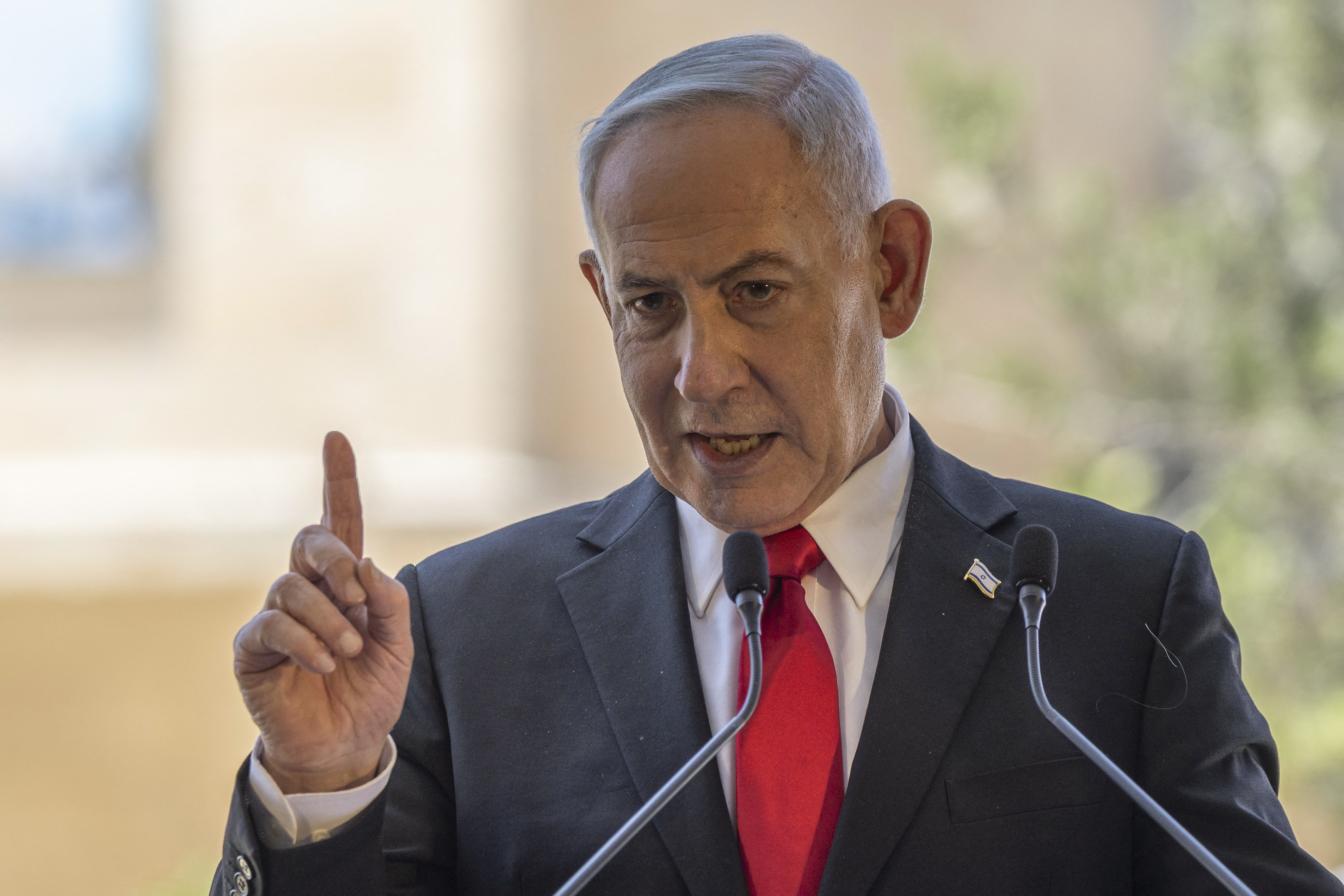 Israel's Prime Minister Benjamin Netanyahu speaks during a cornerstone laying ceremony for the Atarot Heritage Center at an abandon airport in East Jerusalem near the separation wall with the Israeli occupied West Bank city of Ramallah on July 5, 2026. (Photo by ilia YEFIMOVICH / AFP)