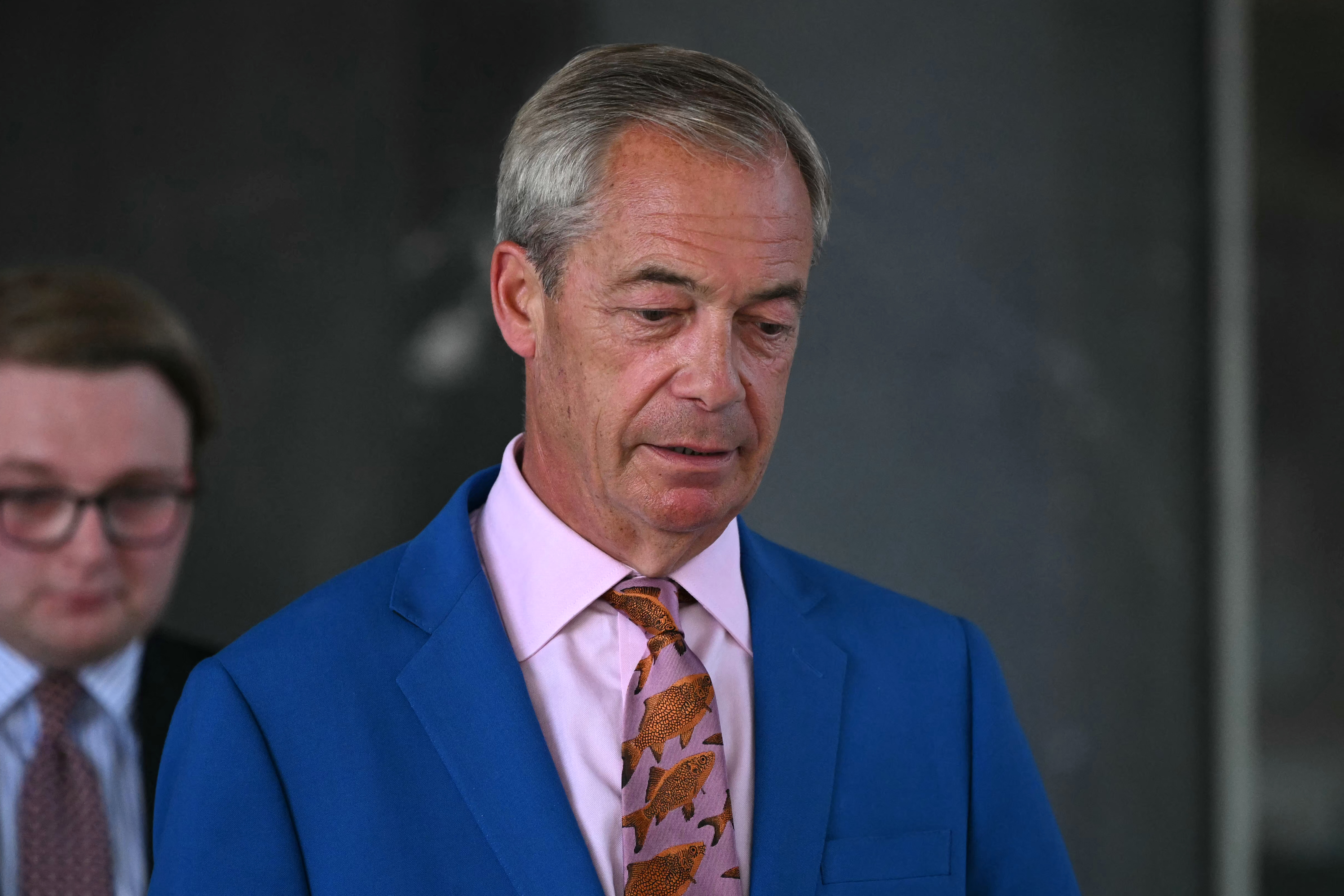 Reform UK Leader Nigel Farage leaves Millbank Tower after making a televised speech in which he resigned as MP for Clacton, in central London on July 7, 2026.